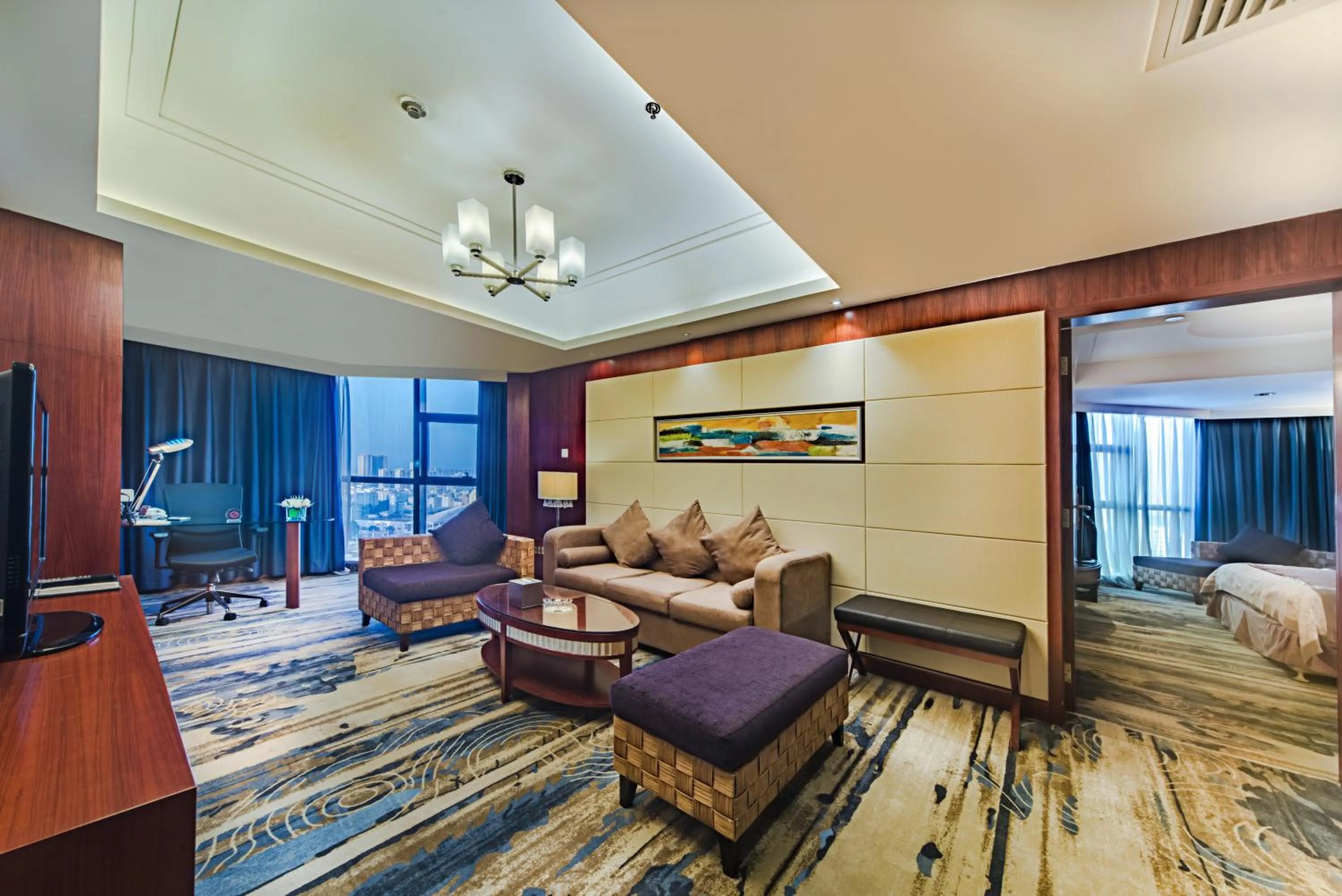 Seating area, Bed in Haikou Mingguang Shengyi Hotel (Previous Mingguang International Hotel)