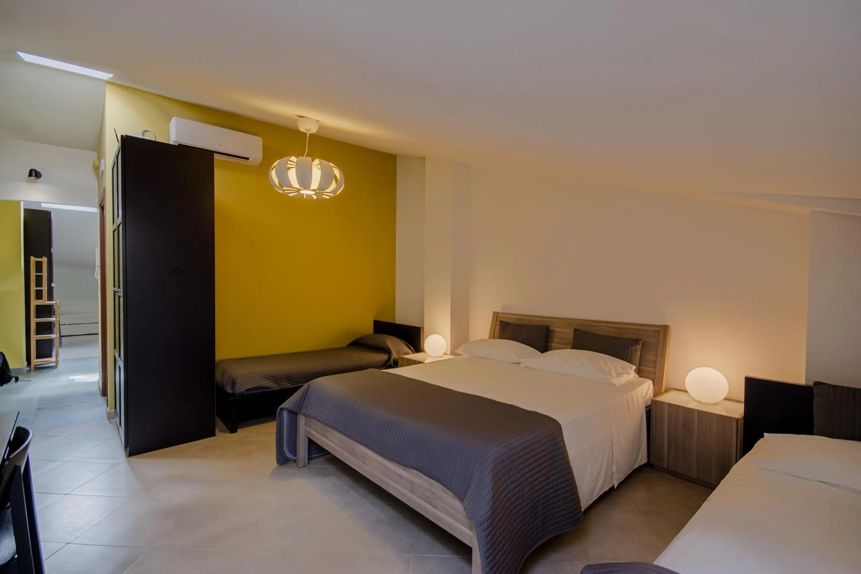 Bed in La Scivola Rooms