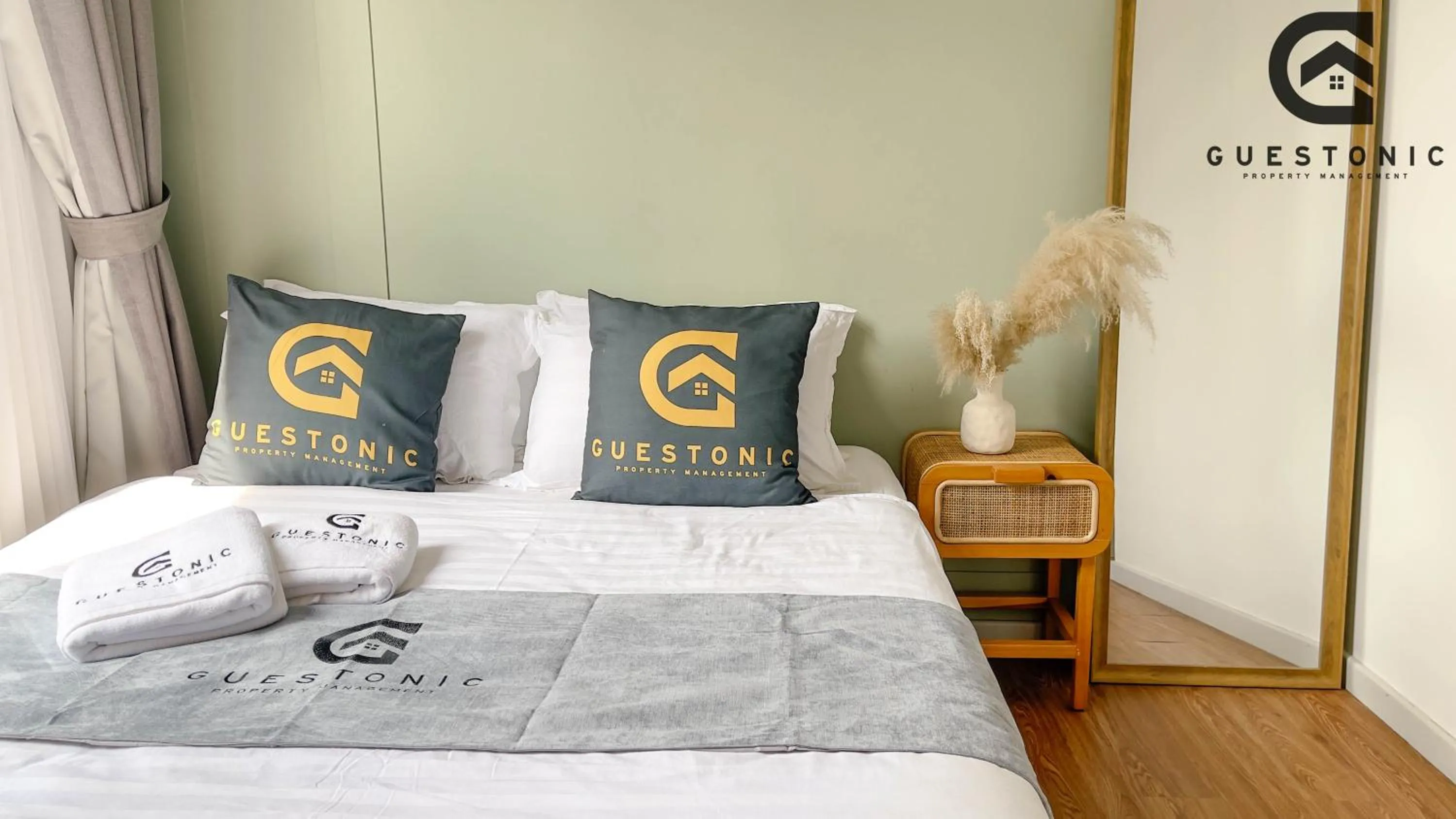 Bed in NeuSuite Cozy Studio by GUESTONIC