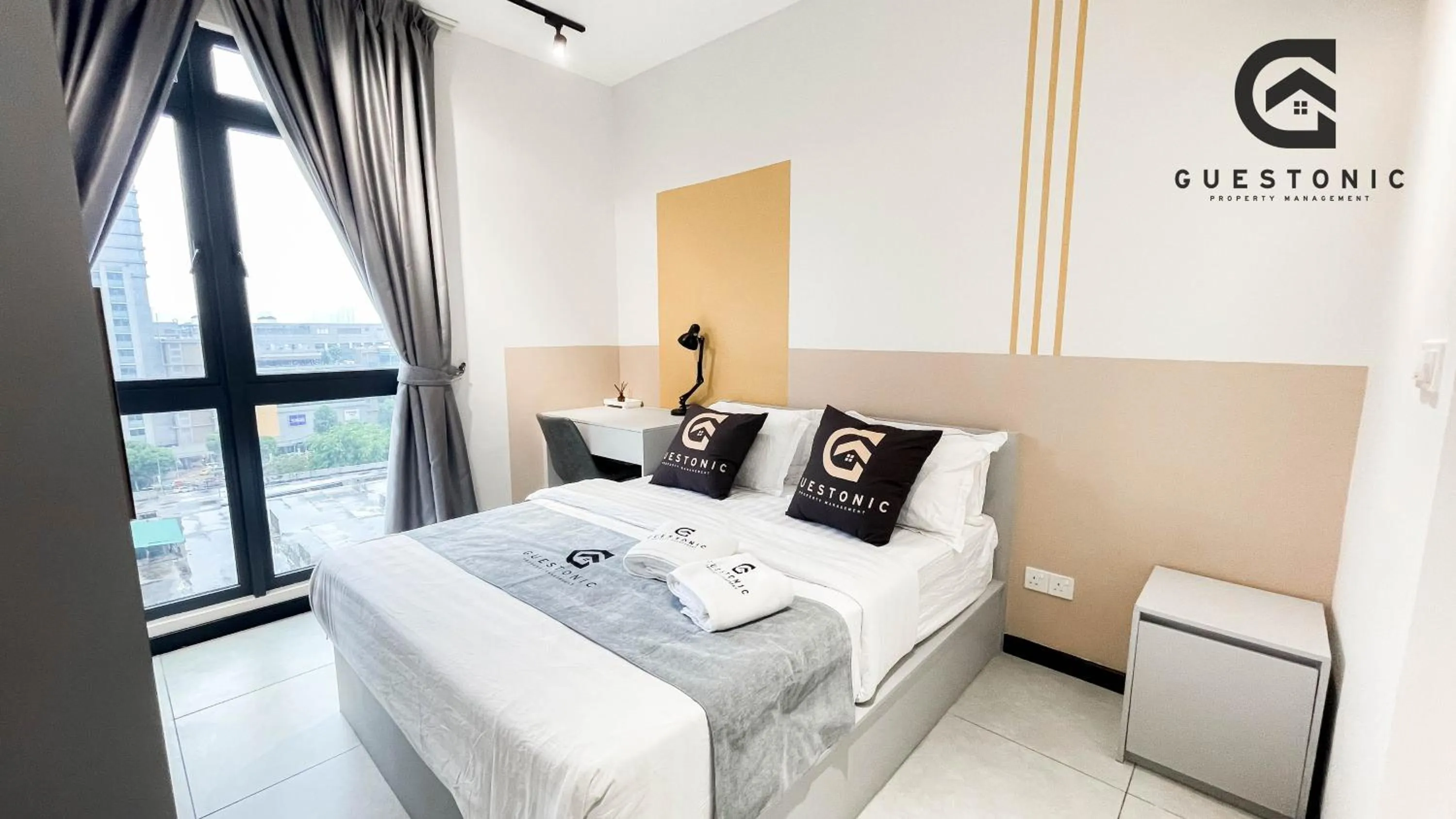 Bed in NeuSuite Cozy Studio by GUESTONIC