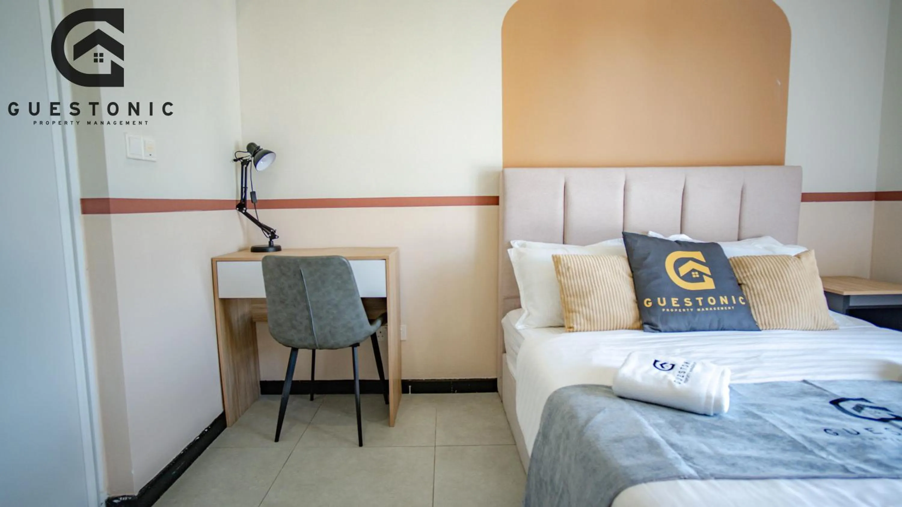 Bed in NeuSuite Cozy Studio by GUESTONIC