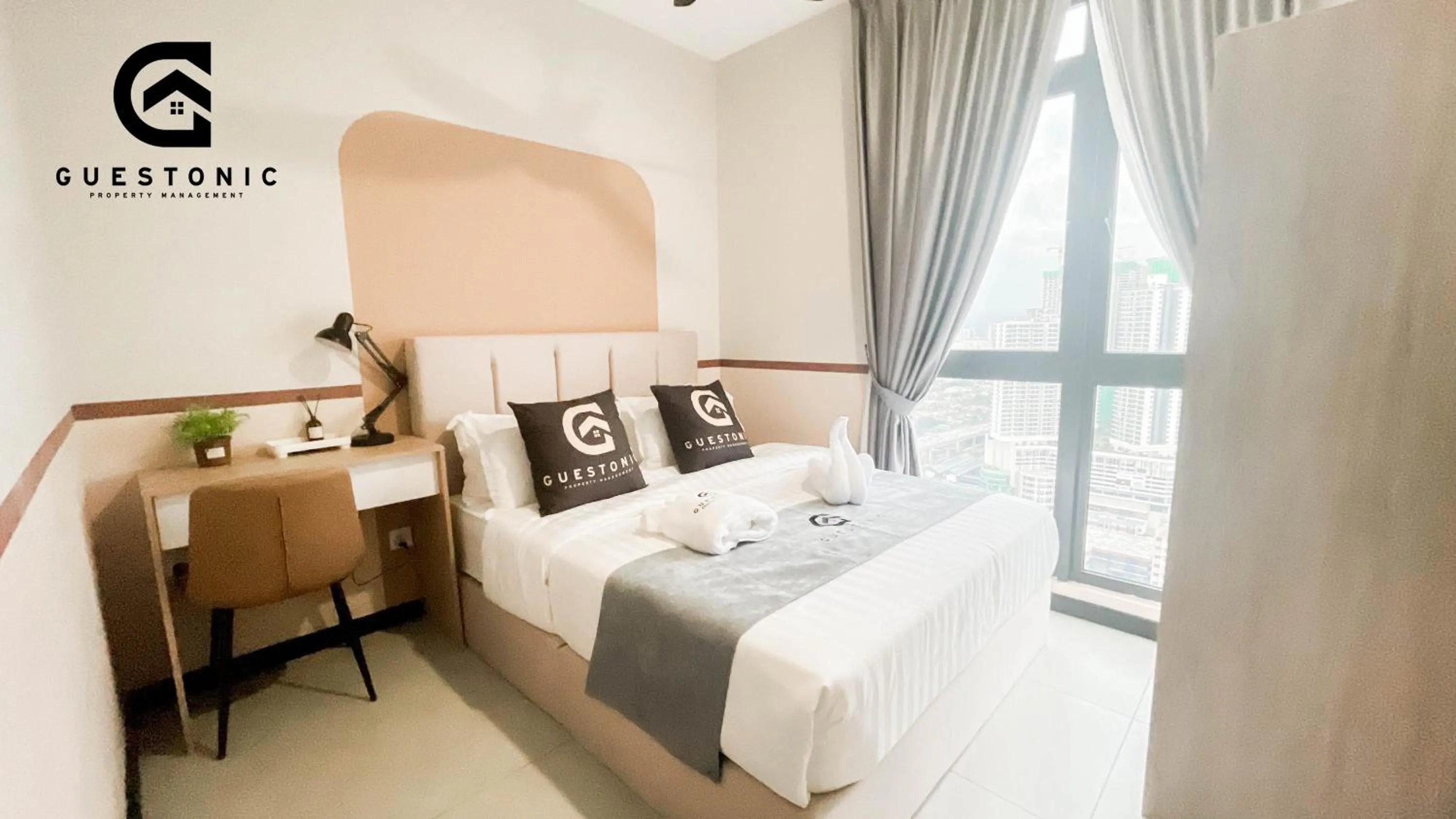 Bed in NeuSuite Cozy Studio by GUESTONIC