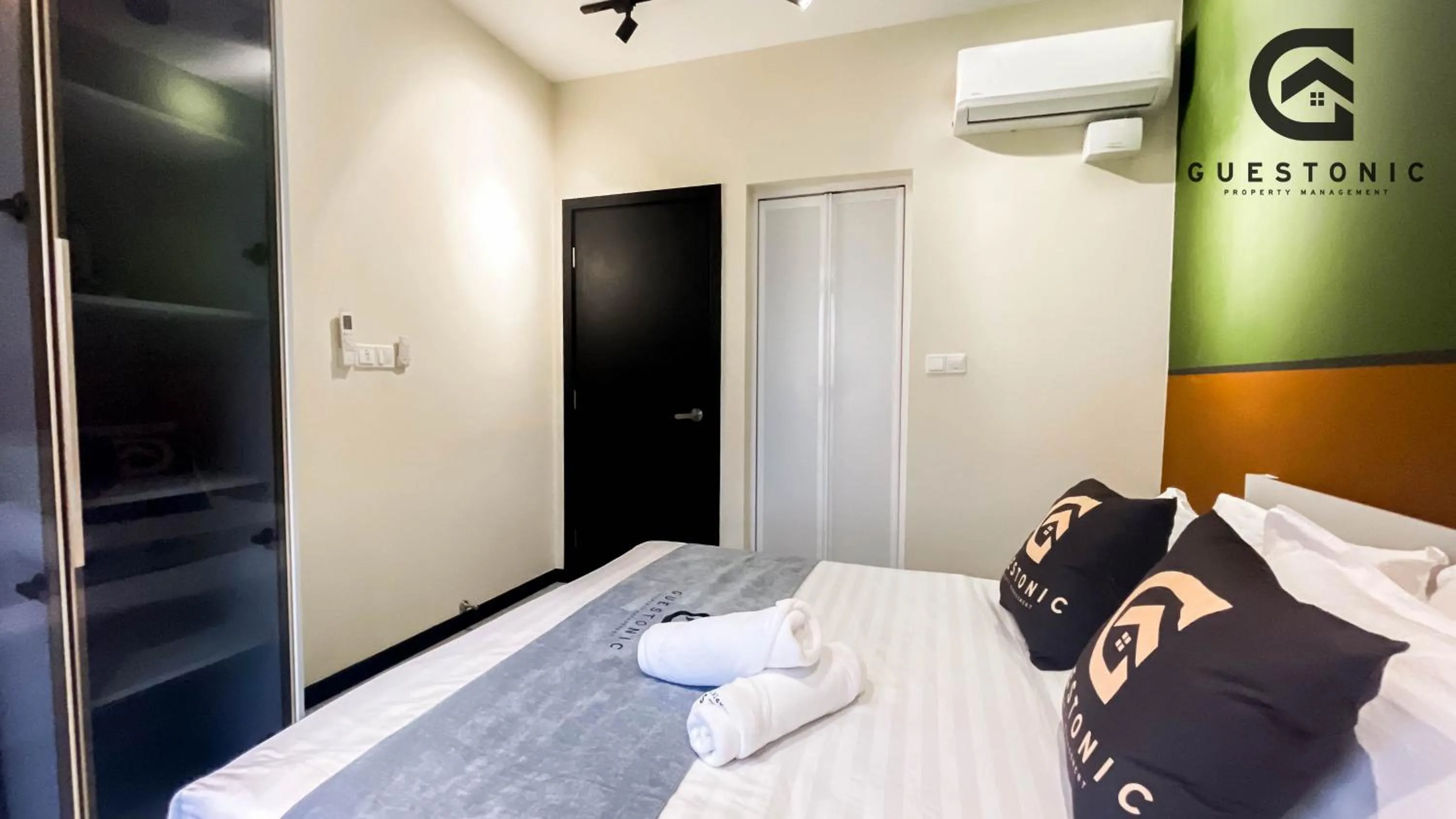 Bed in NeuSuite Cozy Studio by GUESTONIC