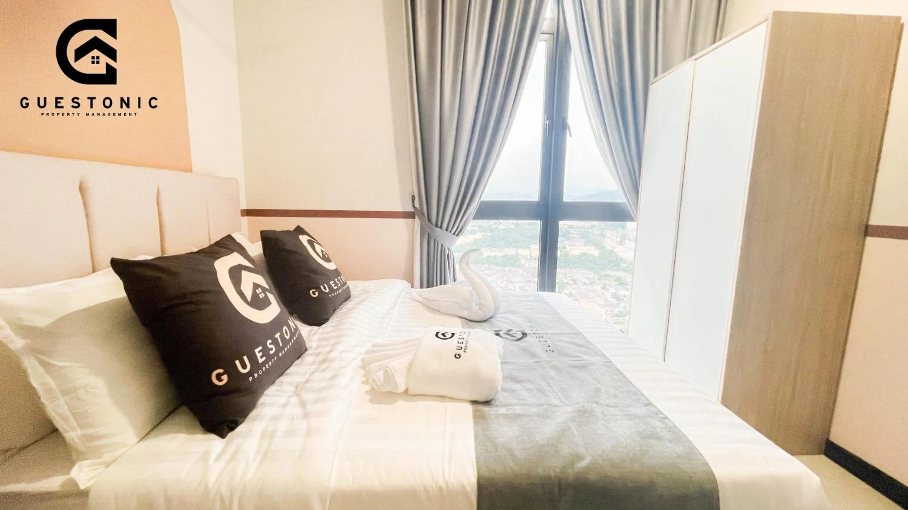 Bed in NeuSuite Cozy Studio by GUESTONIC