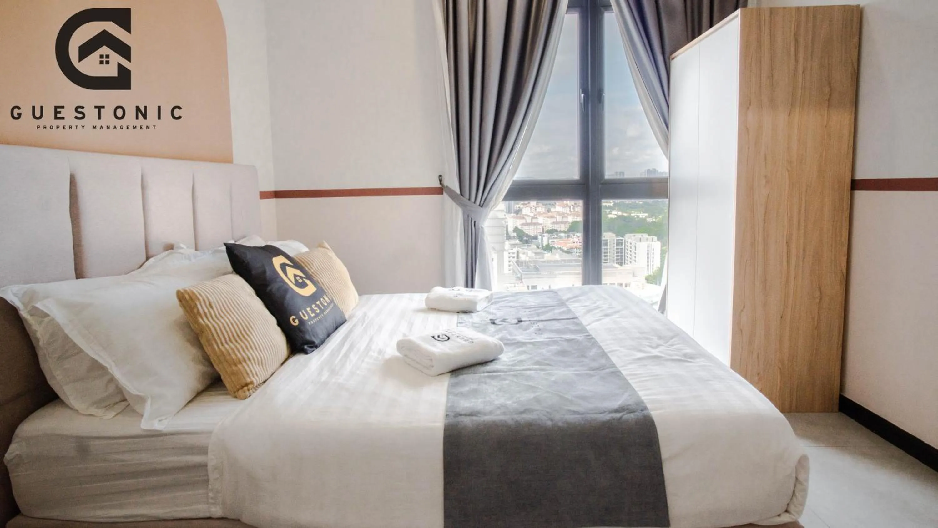 Bed in NeuSuite Cozy Studio by GUESTONIC