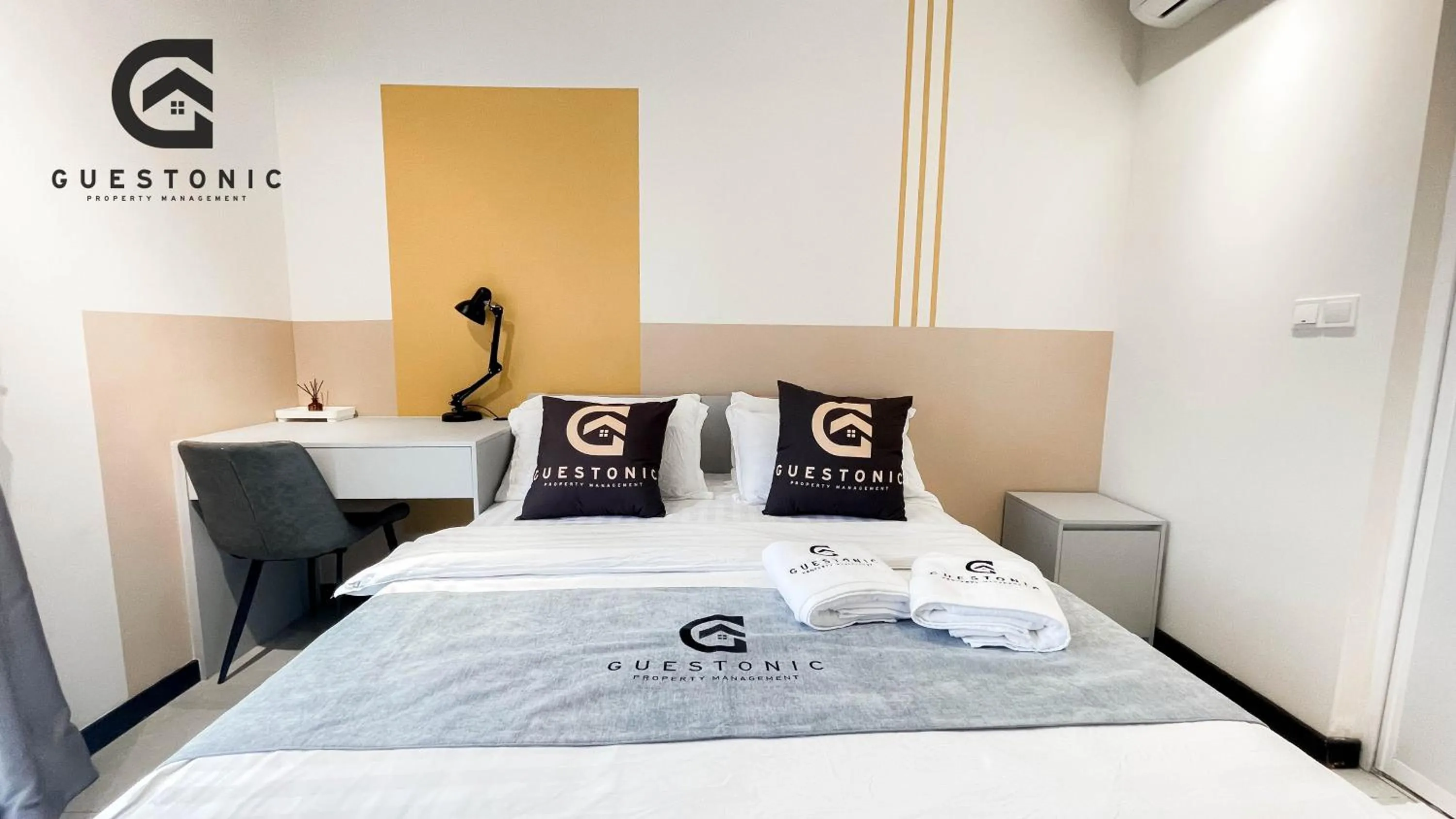 Bed in NeuSuite Cozy Studio by GUESTONIC