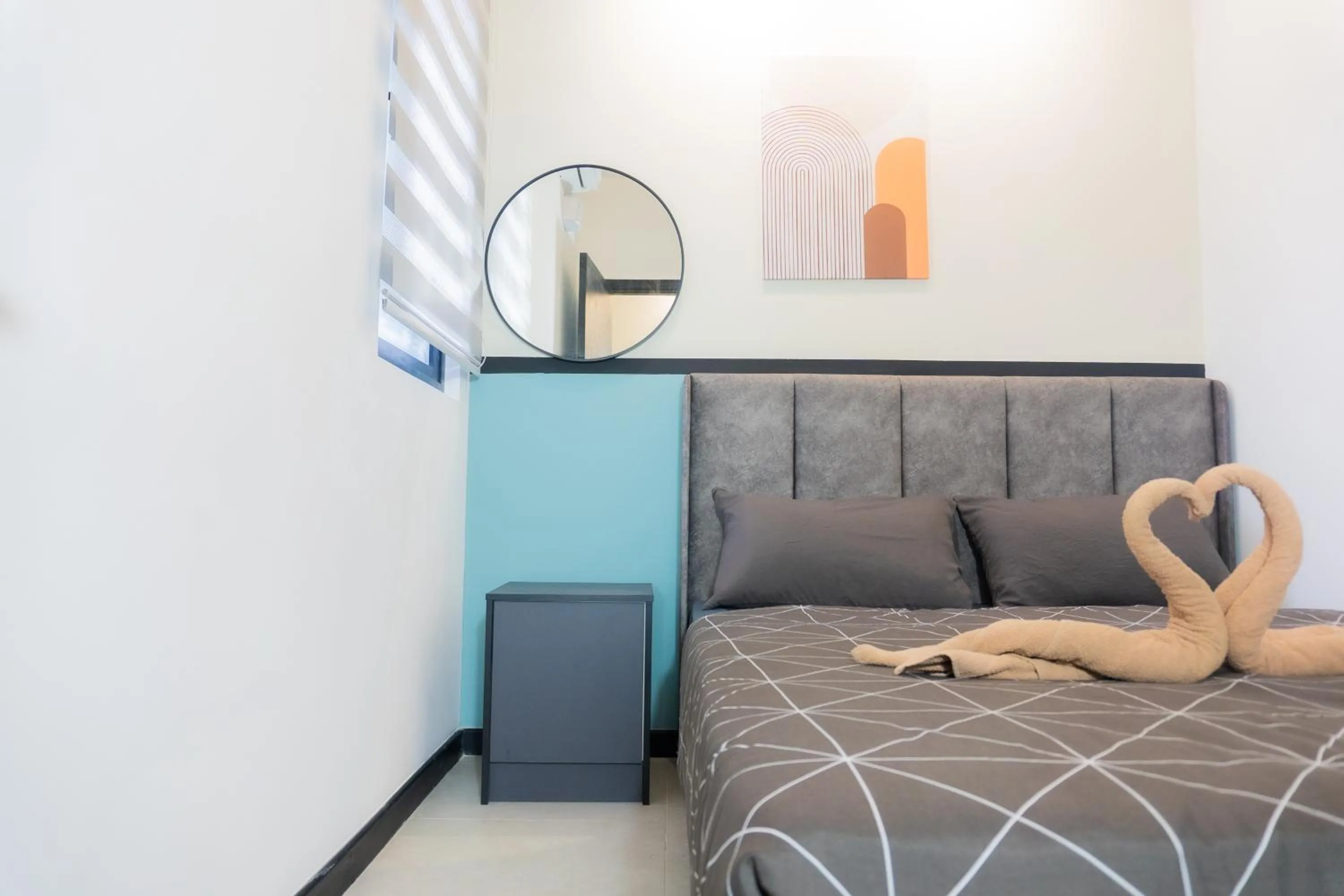 Bed in NeuSuite Cozy Studio by GUESTONIC