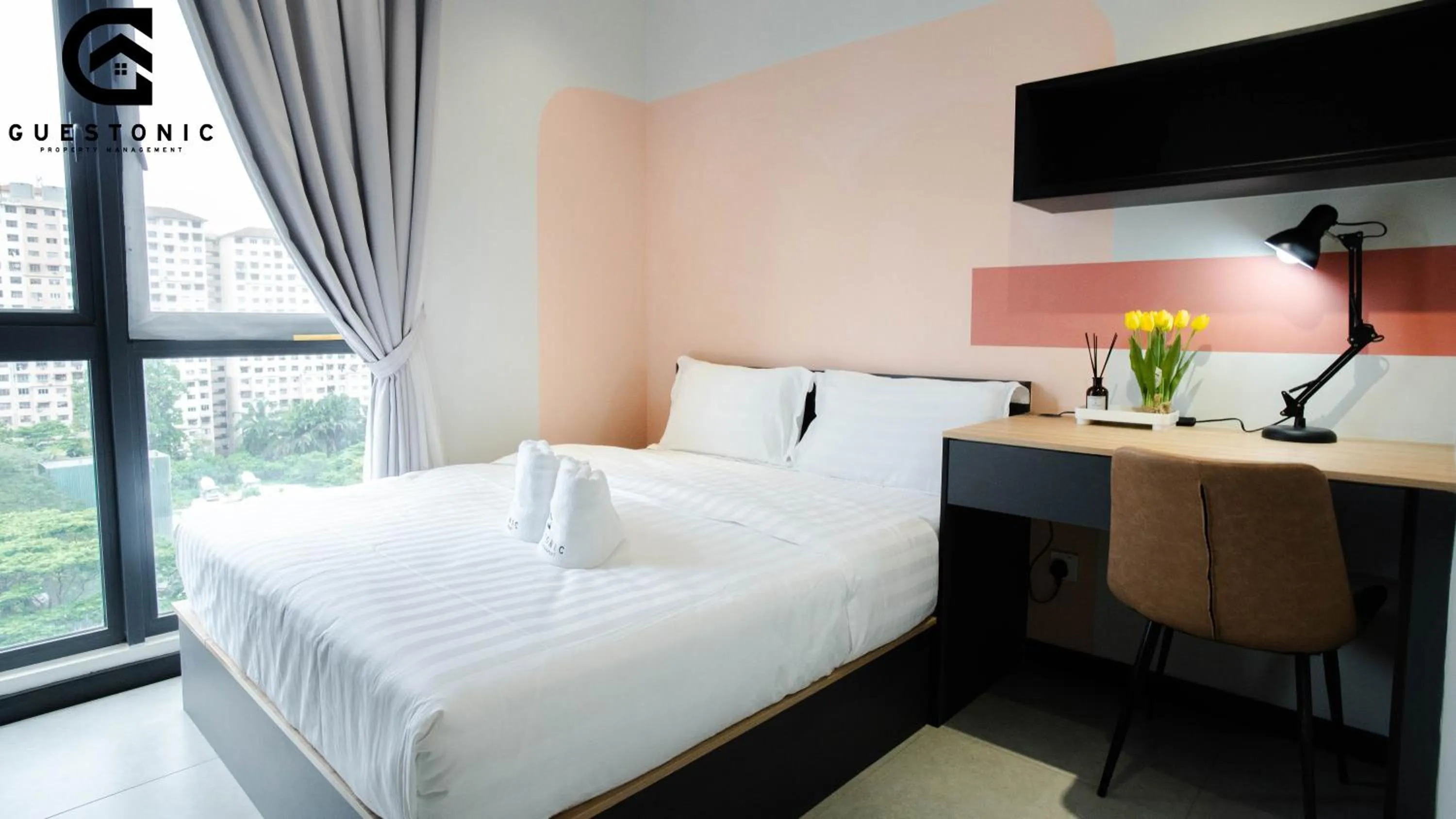 Bed in NeuSuite Cozy Studio by GUESTONIC