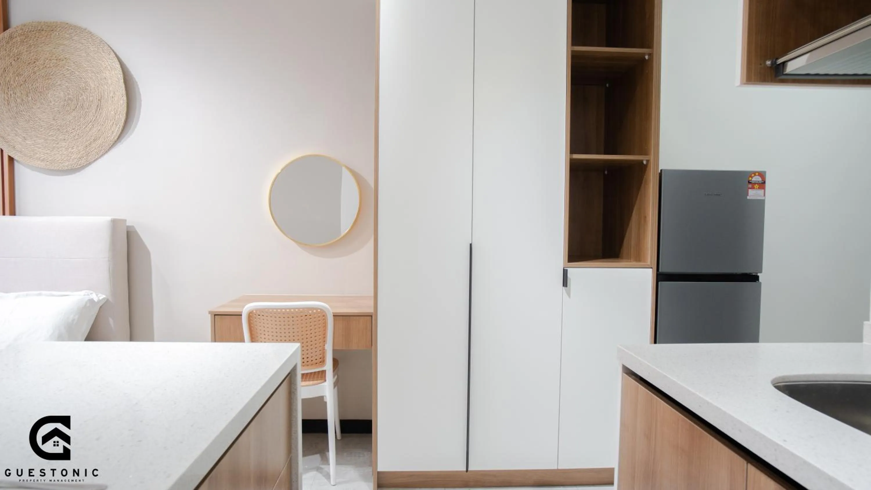 Bed in NeuSuite Cozy Studio by GUESTONIC