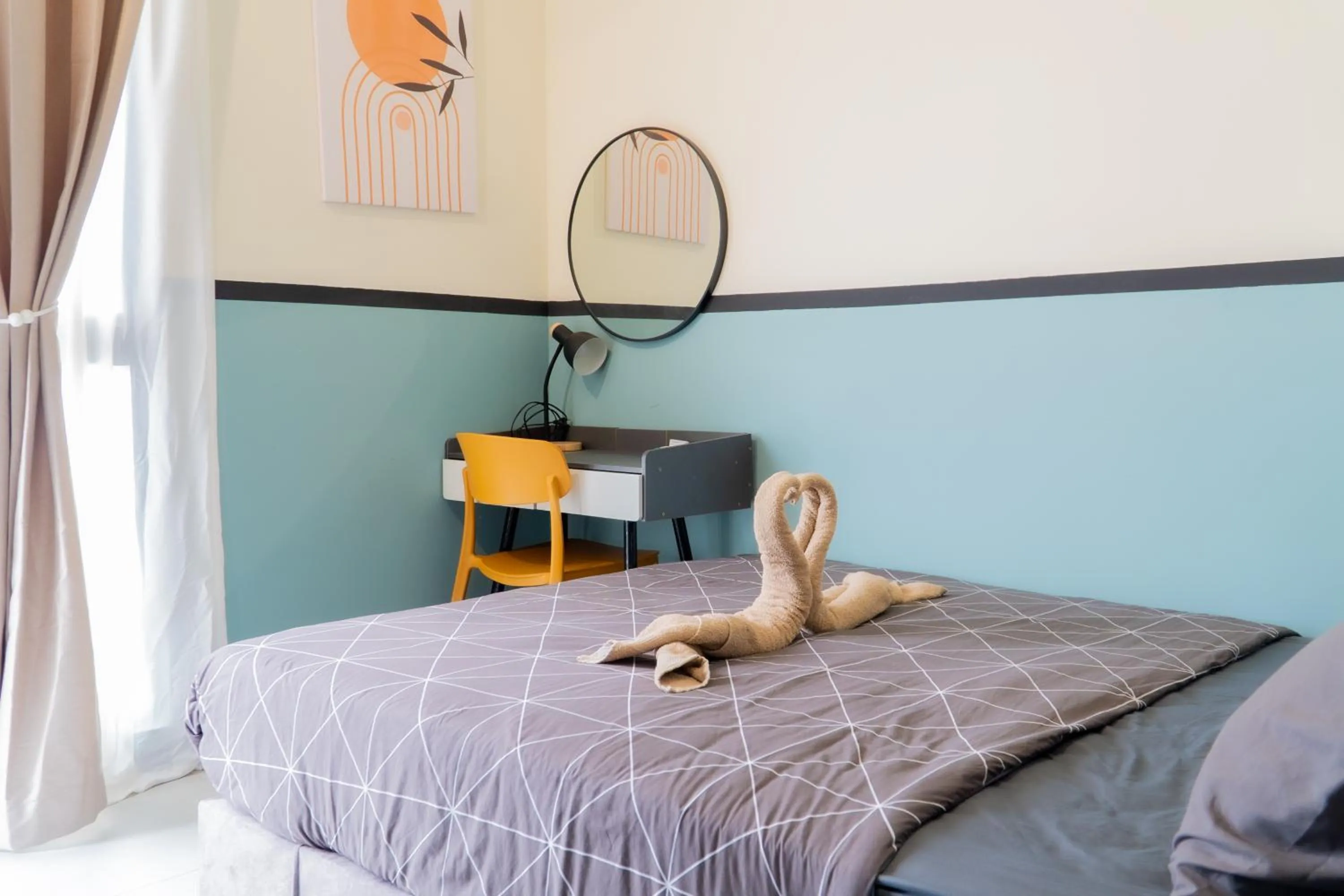 Bed in NeuSuite Cozy Studio by GUESTONIC