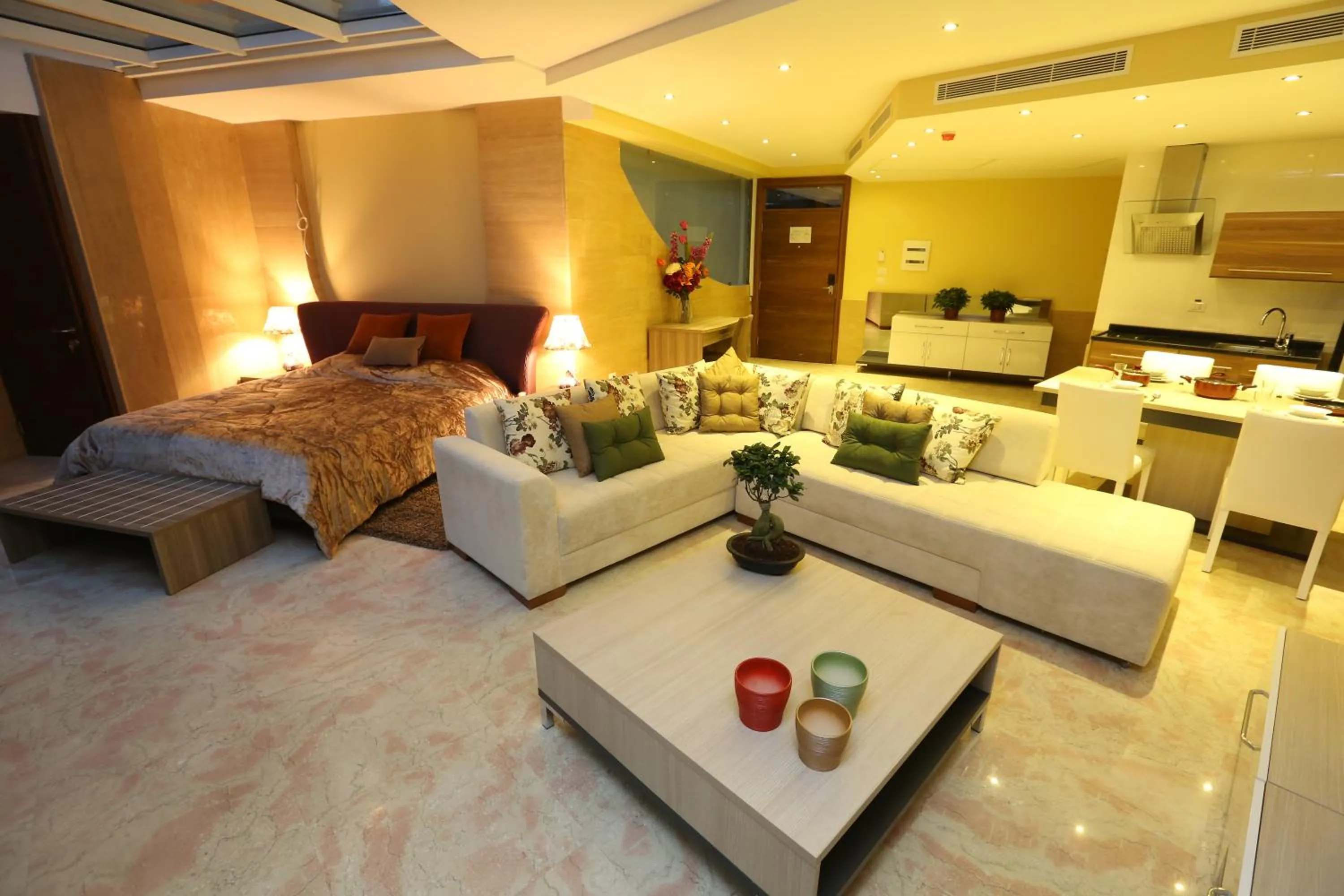 Living room, Bed in Delora Hotel and Suites