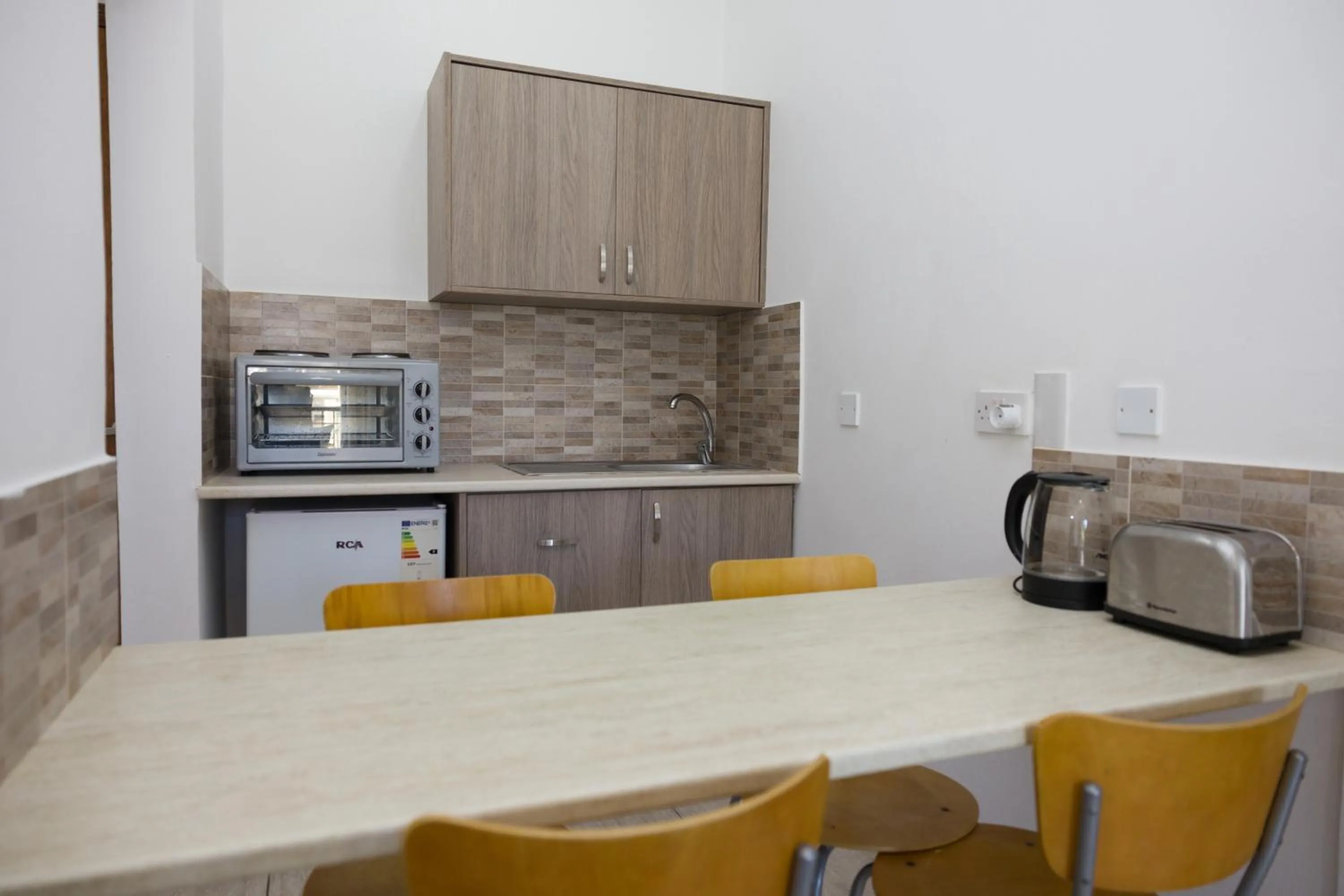 Kitchen or kitchenette in Alecos Hotel Apartments