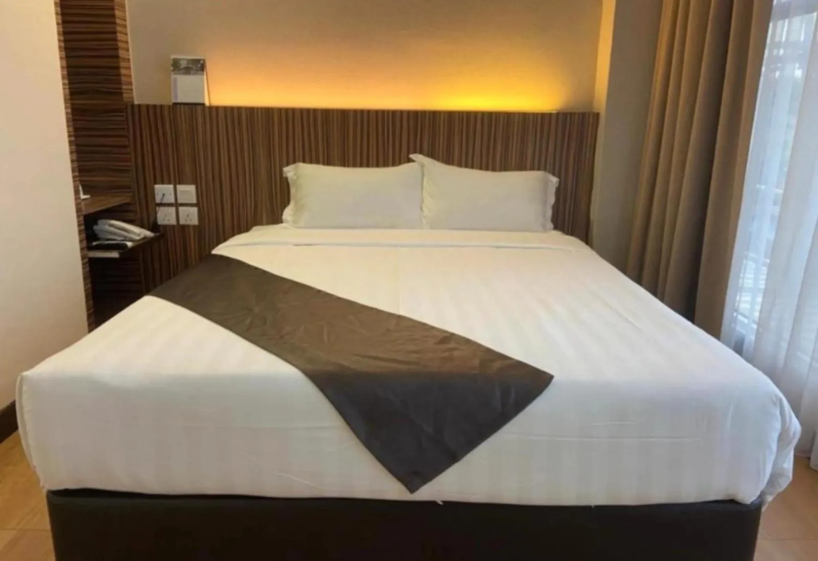 Bed in Hotel EzzyHome Kebun Teh