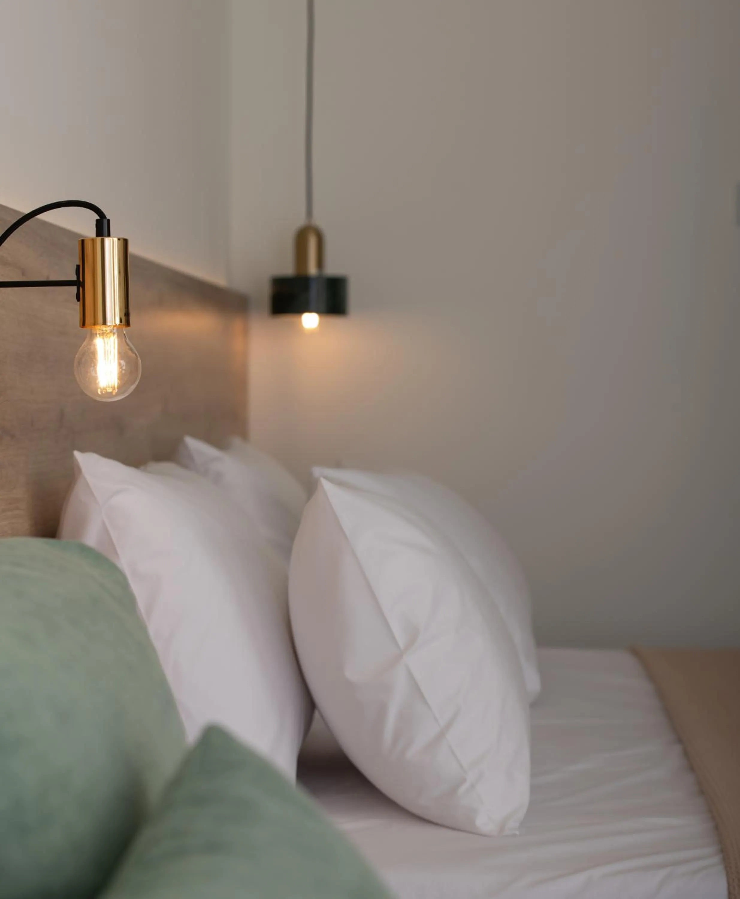 Bed in Aetherion Studios & Suites