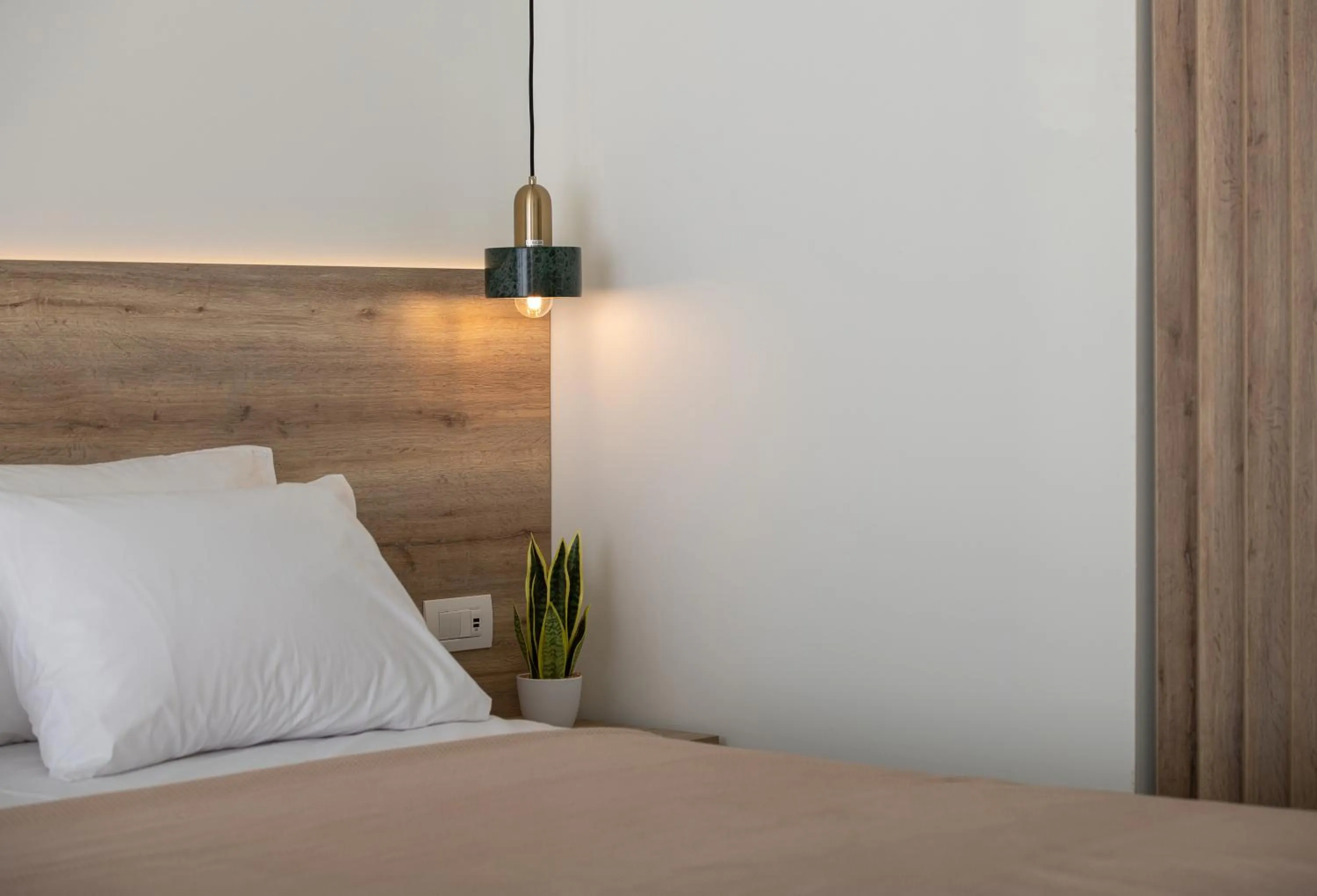 Bed in Aetherion Studios & Suites