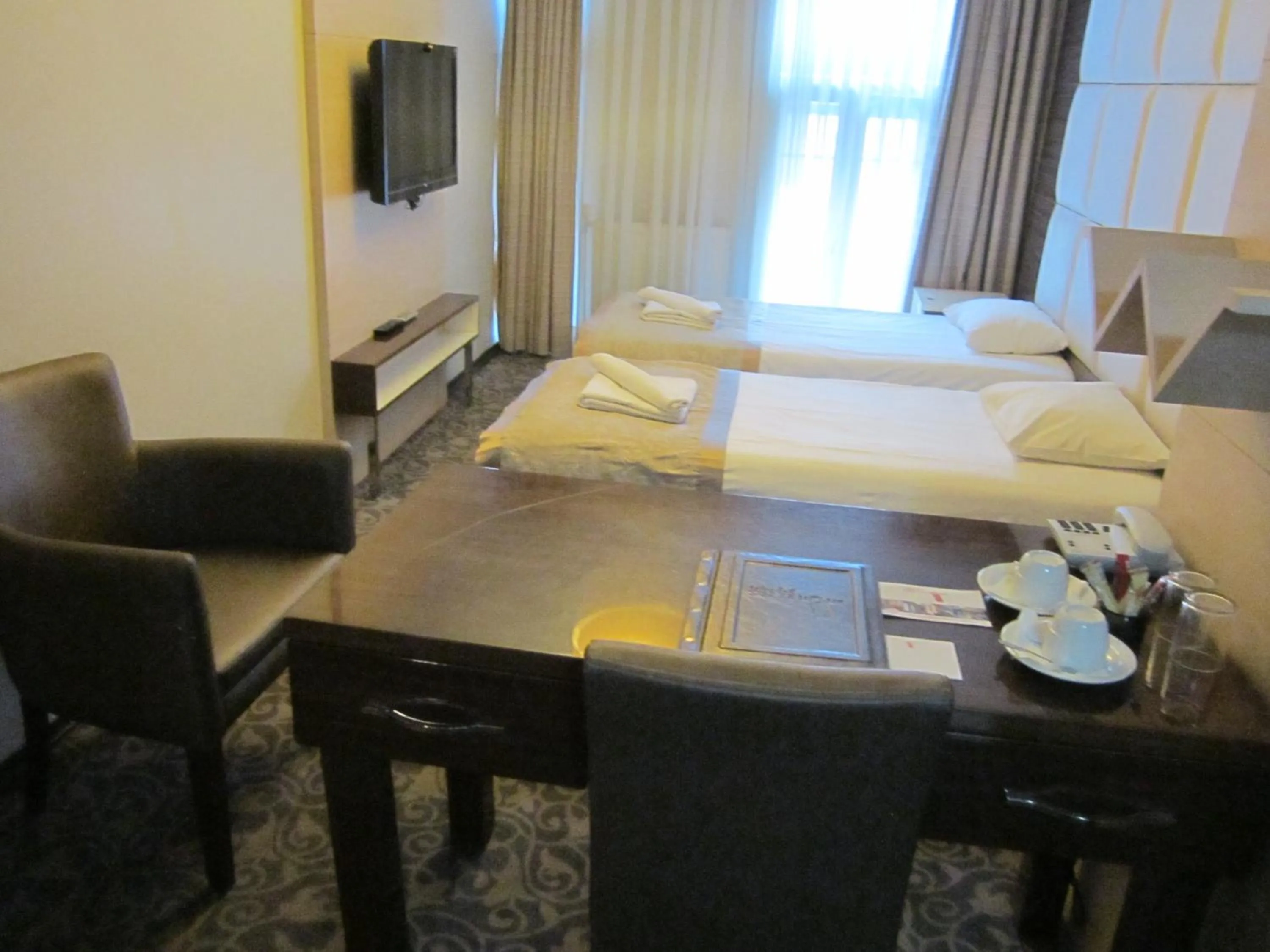 Bed in Derpa Suite Hotel