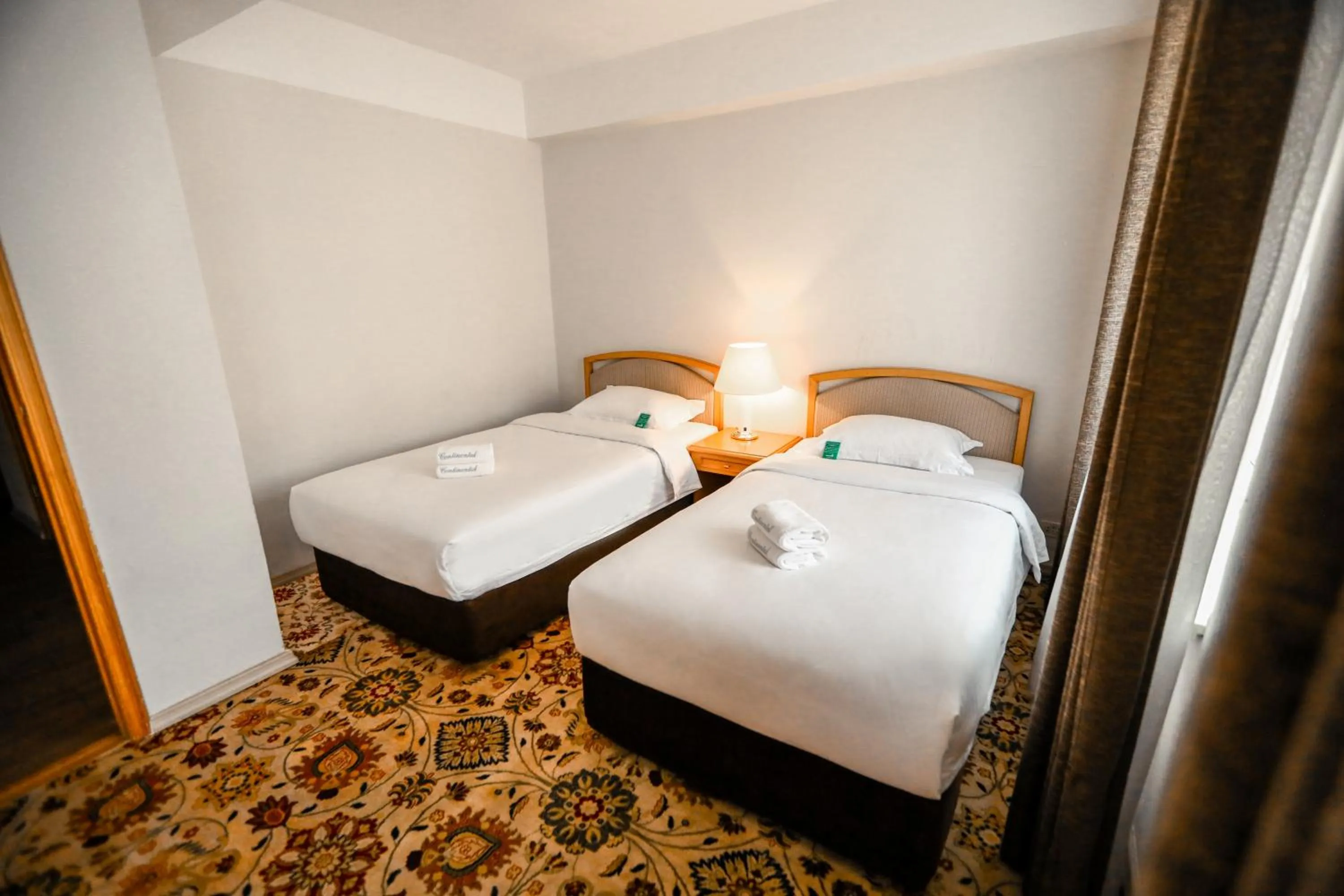 Bed in Continental Hotel