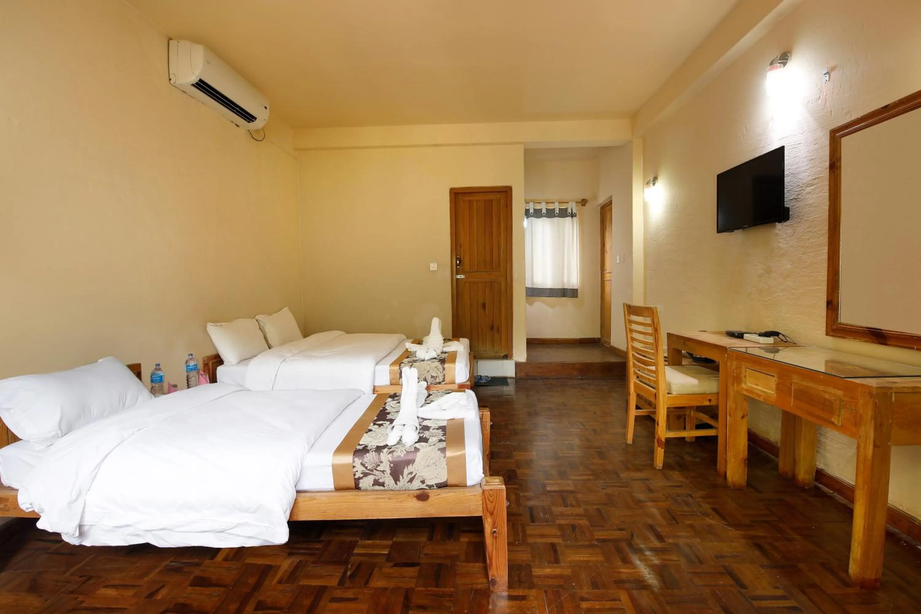 Photo of the whole room, Bed in Chitwan Paradise Hotel