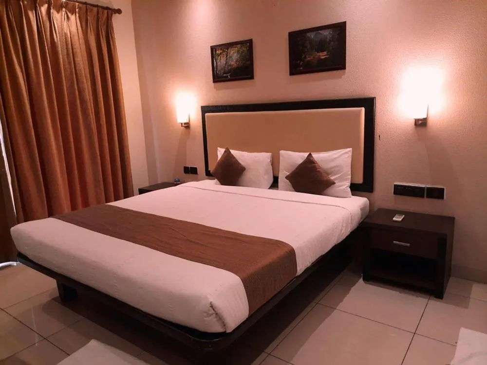 Bed in Hotel Nagarjuna Suites