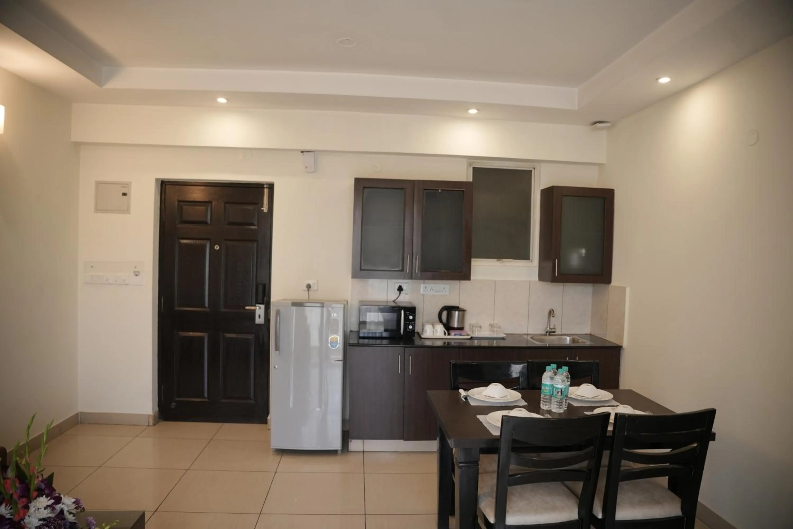 Kitchen or kitchenette in Hotel Nagarjuna Suites