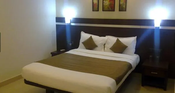 Bed in Hotel Nagarjuna Suites
