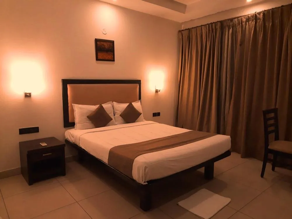 Bed in Hotel Nagarjuna Suites