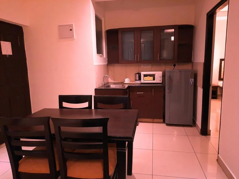 Kitchen or kitchenette in Hotel Nagarjuna Suites