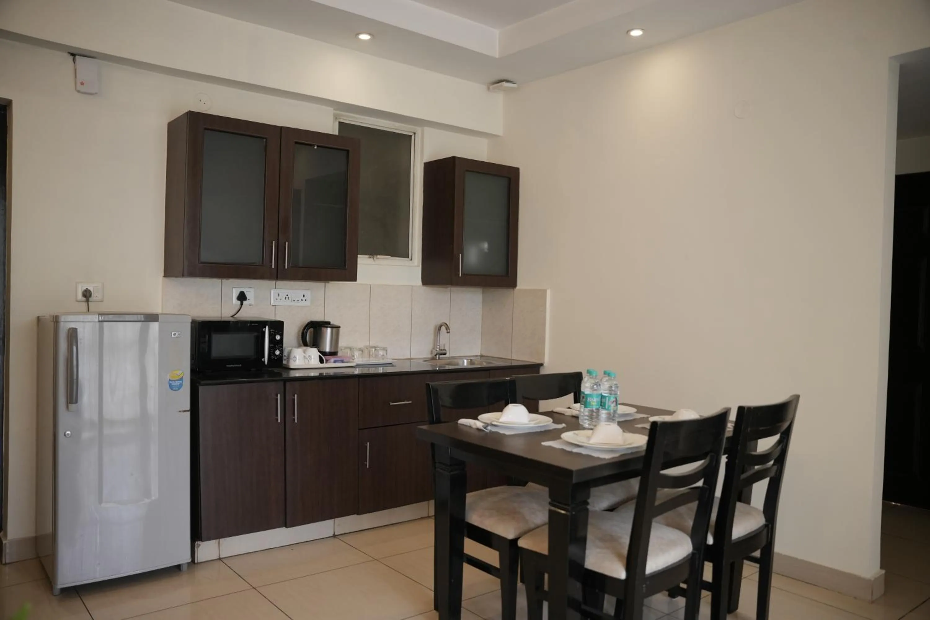 Kitchen or kitchenette in Hotel Nagarjuna Suites