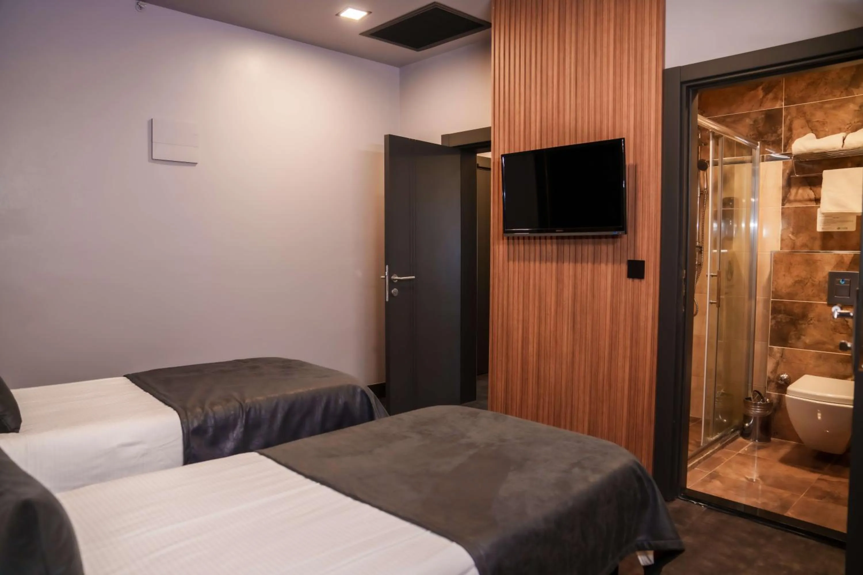 Bed in SennaCity Hotel