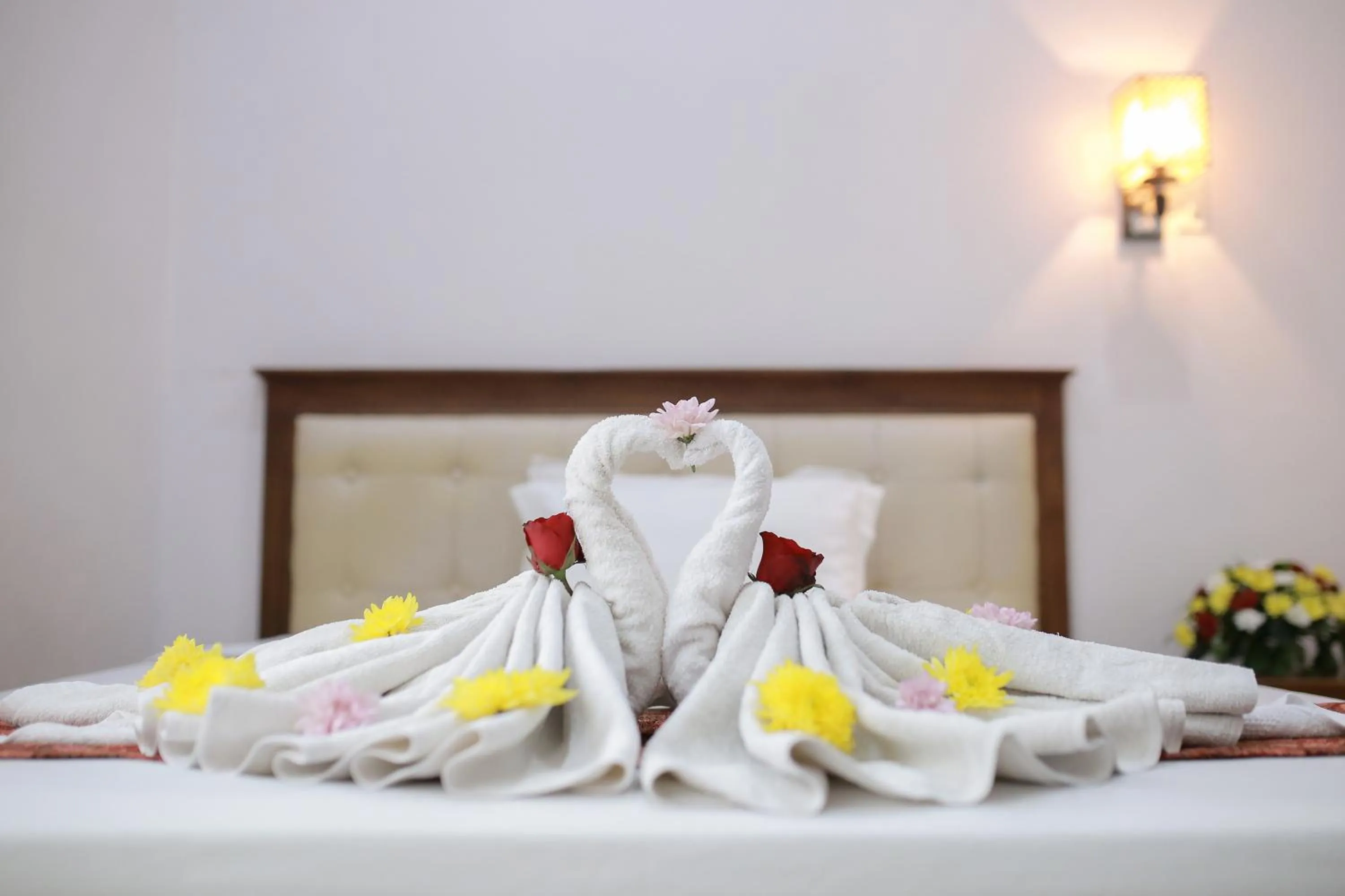 Bed in WISMA KUSUMA HOTEL