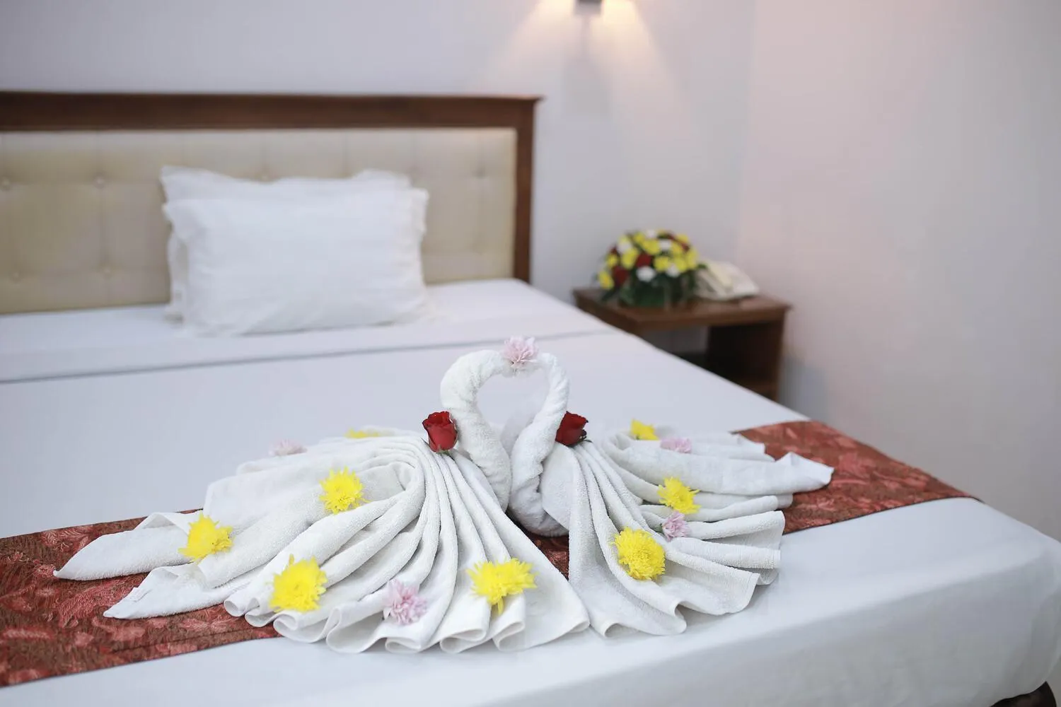 Bed in WISMA KUSUMA HOTEL