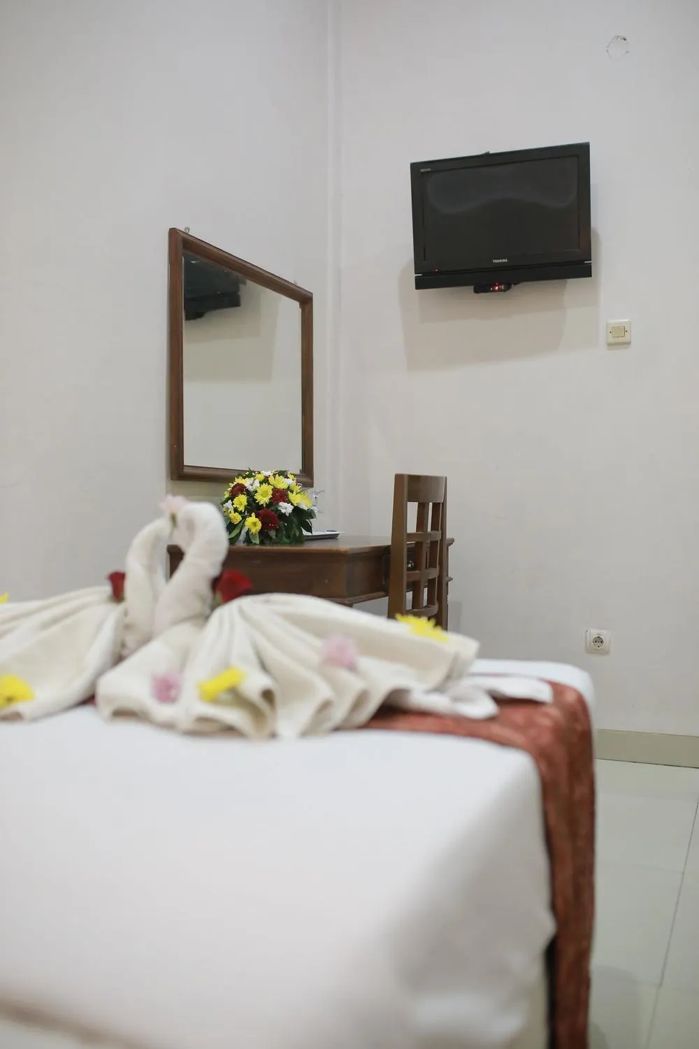 Bed in WISMA KUSUMA HOTEL