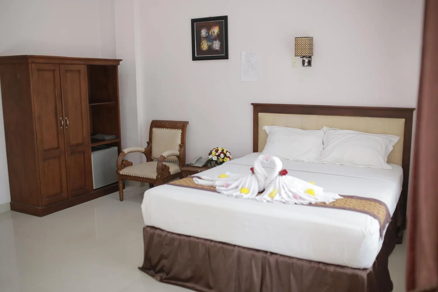 Bed in WISMA KUSUMA HOTEL