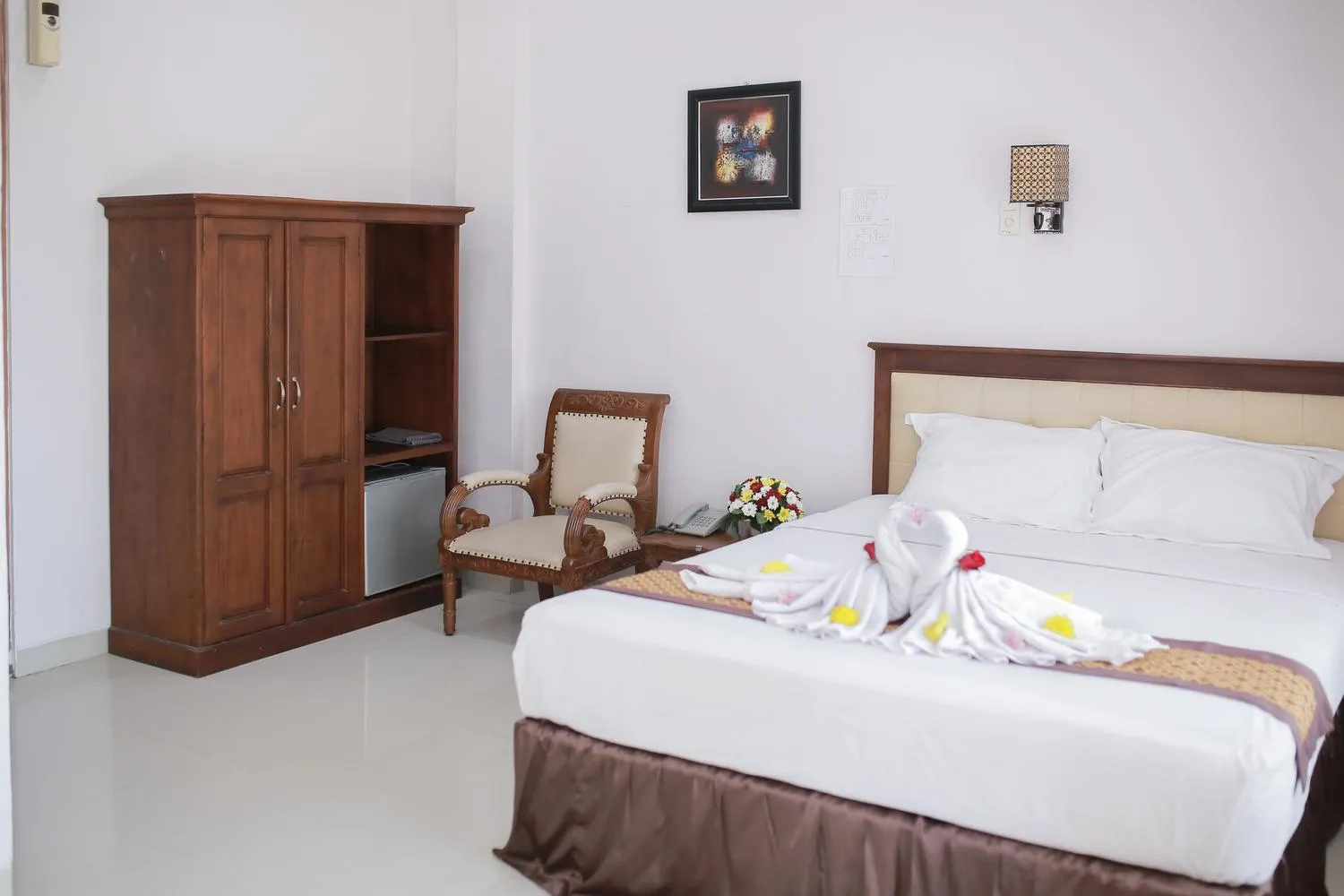 Bed in WISMA KUSUMA HOTEL