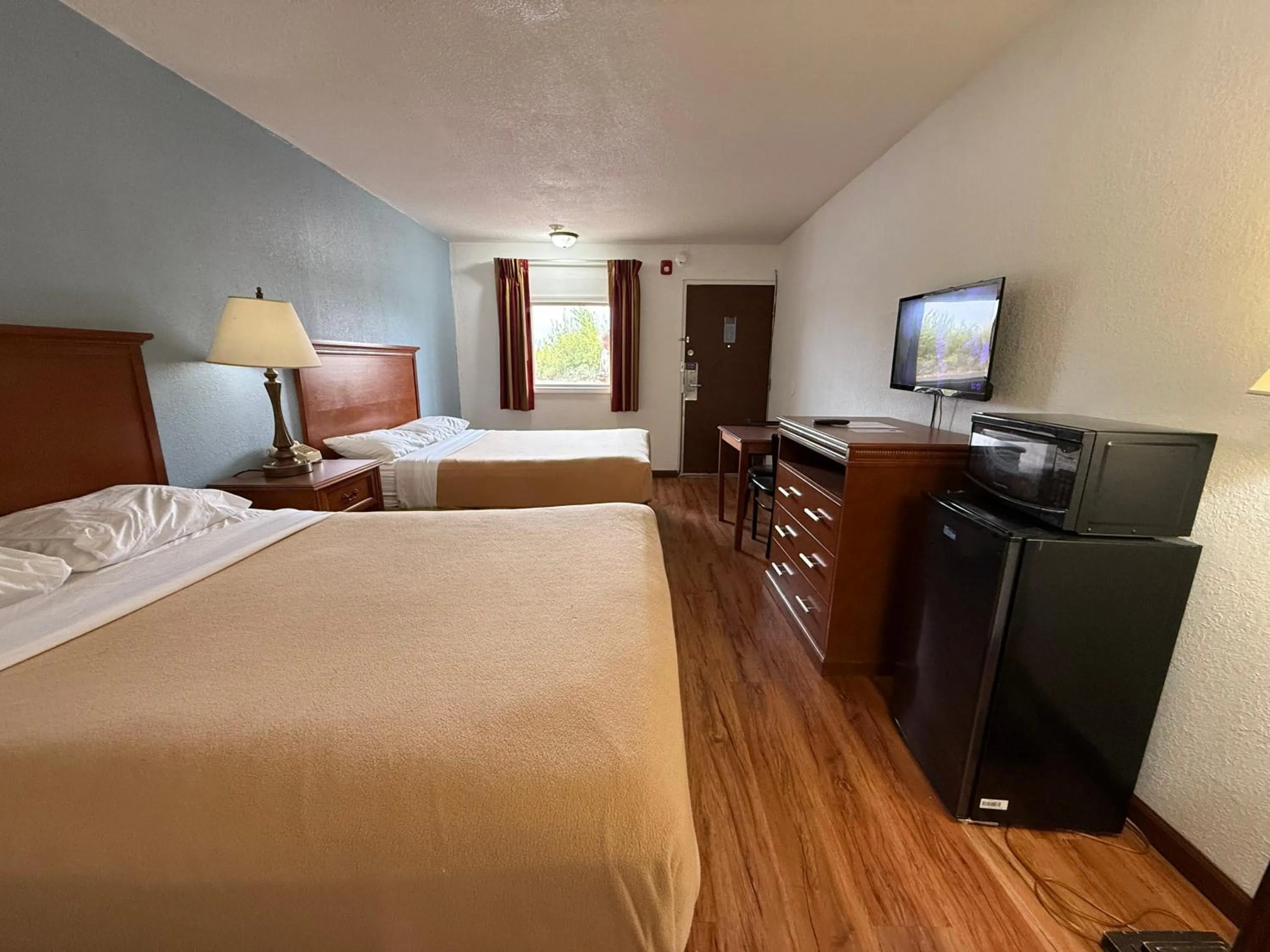 Bed in Relax Inn & Suites