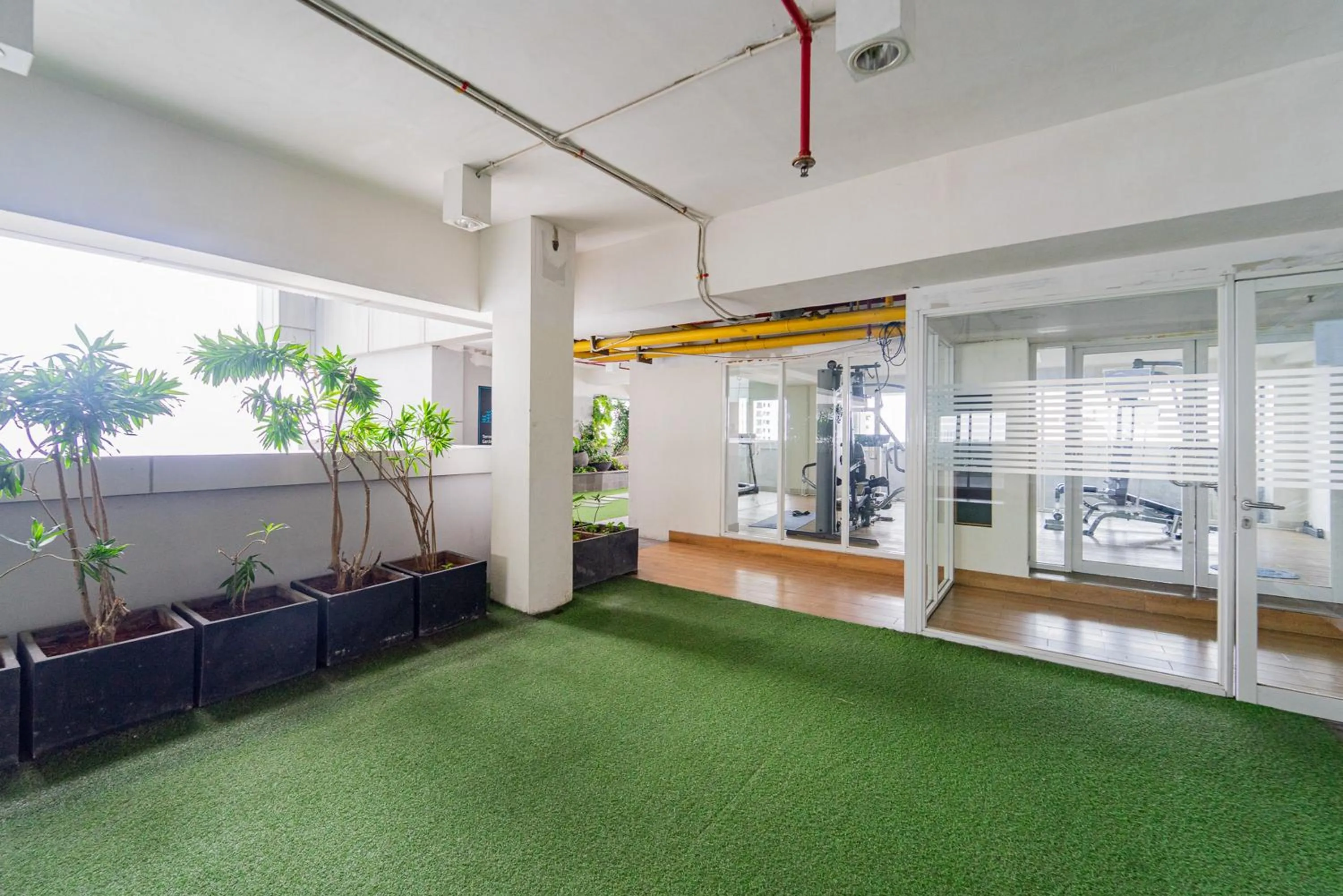 Property building in RedLiving Apartemen Grand Kamala Lagoon - Rooms 911 Tower Barclay South with Netflix