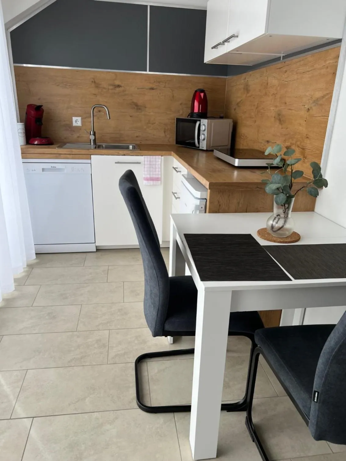 Kitchen or kitchenette in New Age Boardinghaus Bad Wimpfen