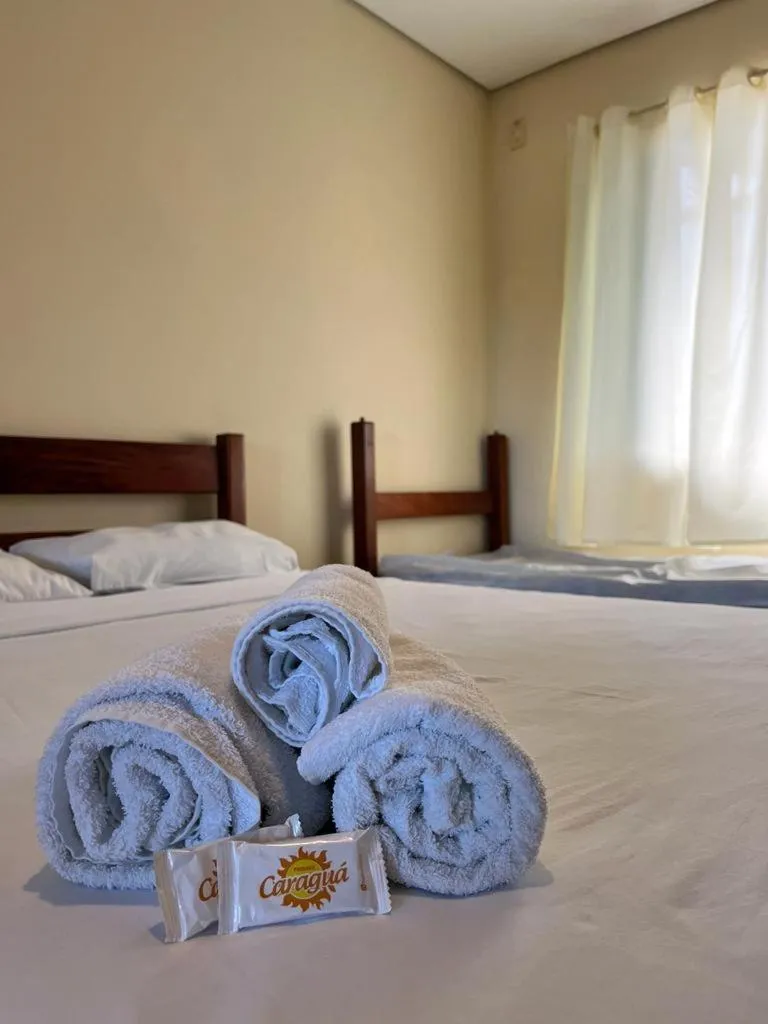 Bed in Pousada Caraguá
