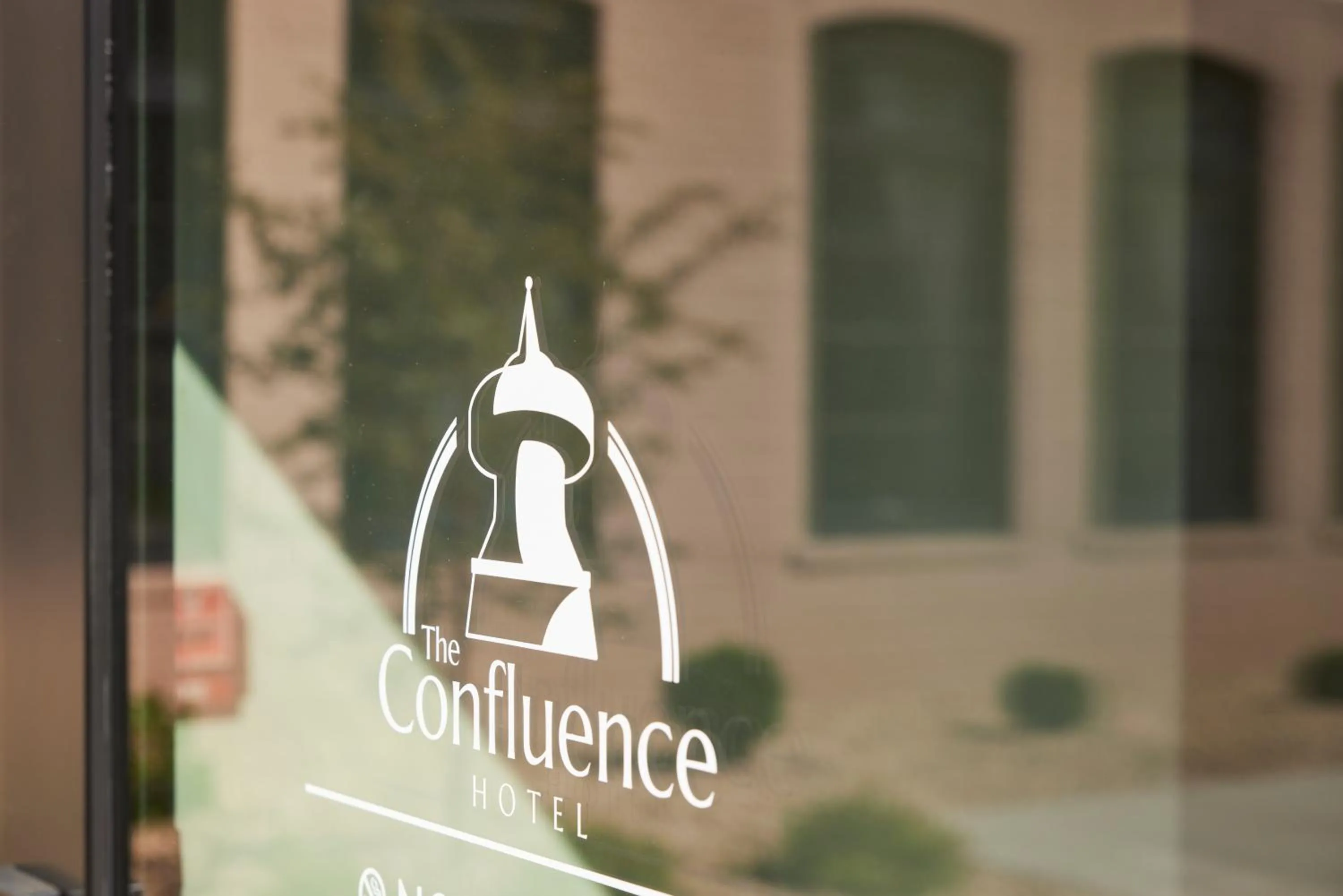 Property logo or sign in The Confluence Hotel