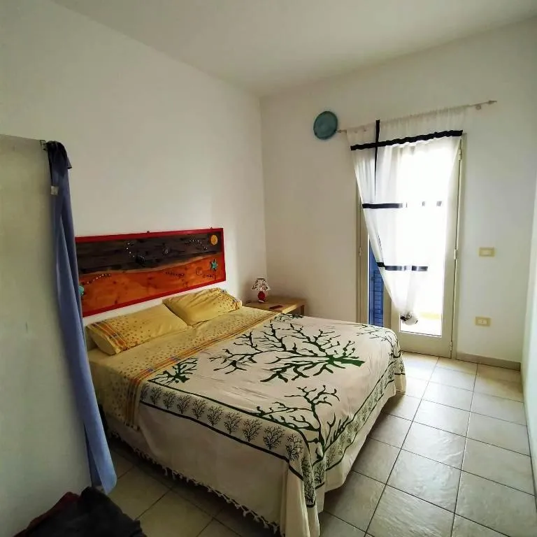 Photo of the whole room, Bed in Residence Giglio