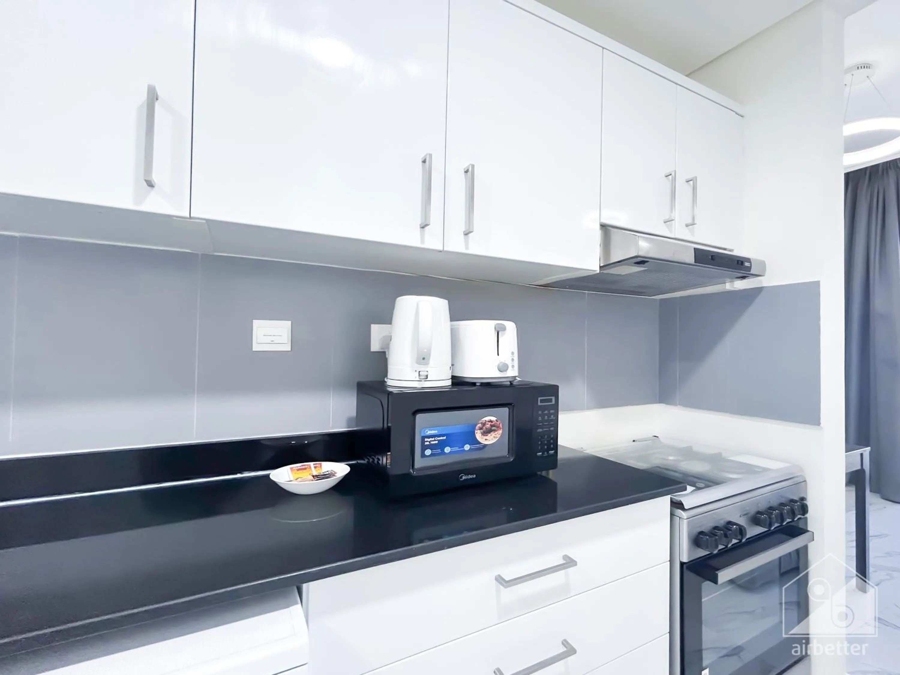 Kitchen or kitchenette in Spacious Studio with balcony in AL Majan