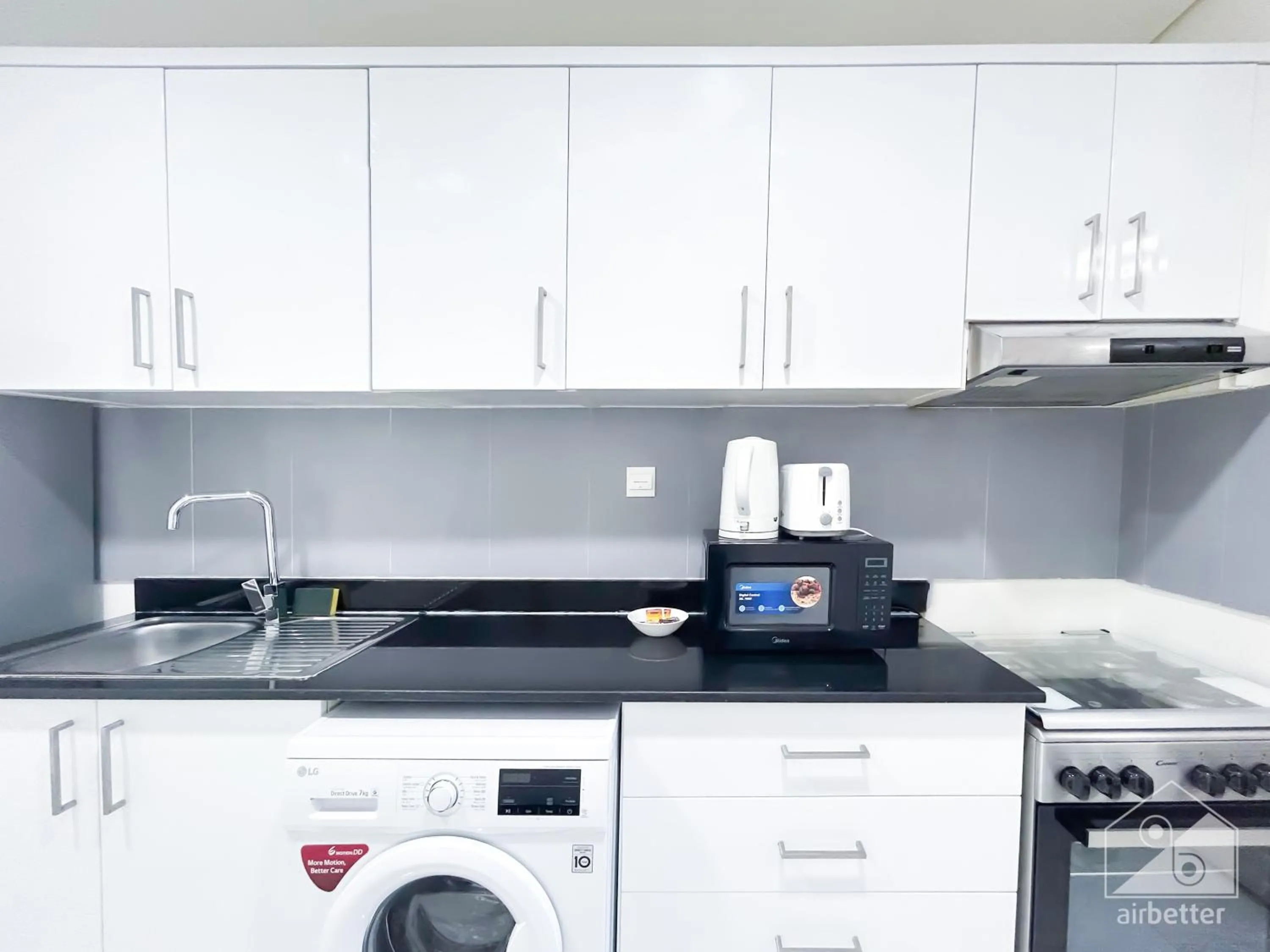 Kitchen or kitchenette in Spacious Studio with balcony in AL Majan