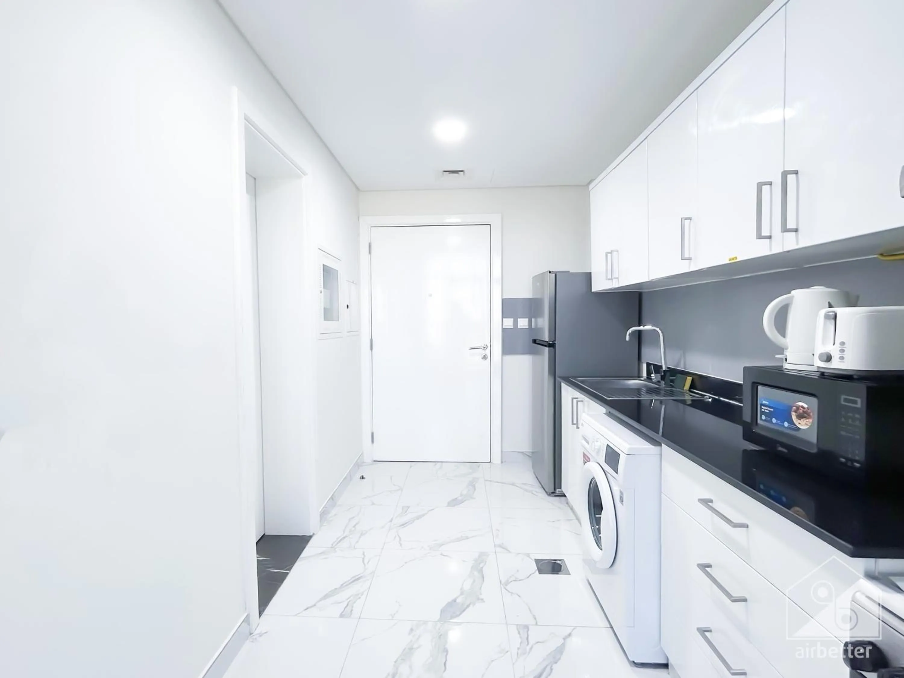 Kitchen or kitchenette in Spacious Studio with balcony in AL Majan