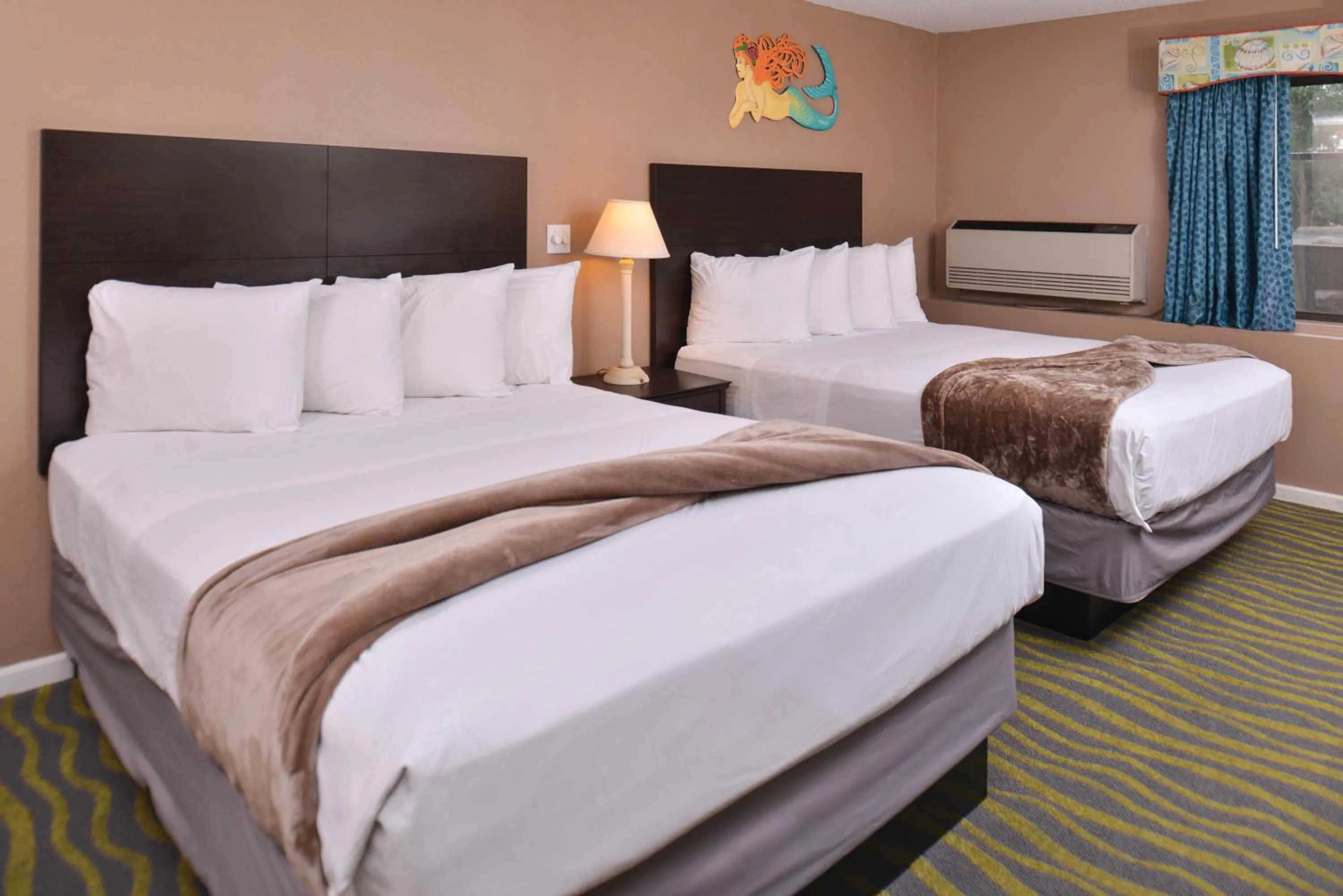 Bedroom in Atlantis Family Waterpark Hotel, an Ascend Collection Hotel