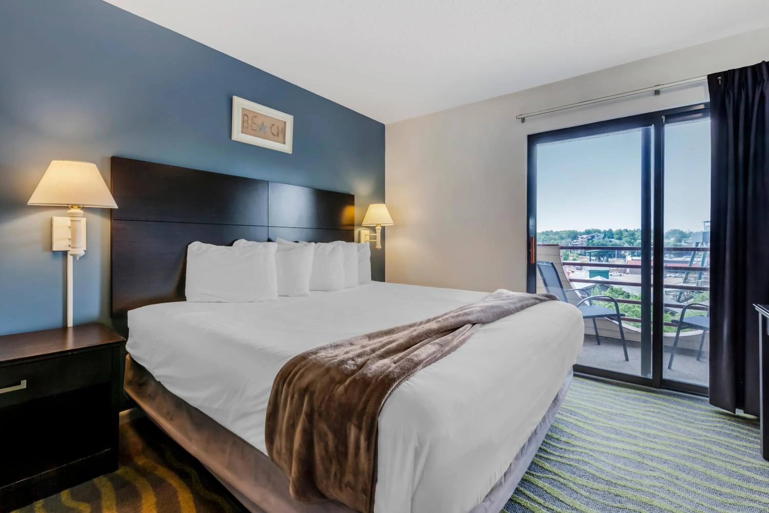 Bed in Atlantis Family Waterpark Hotel, an Ascend Collection Hotel