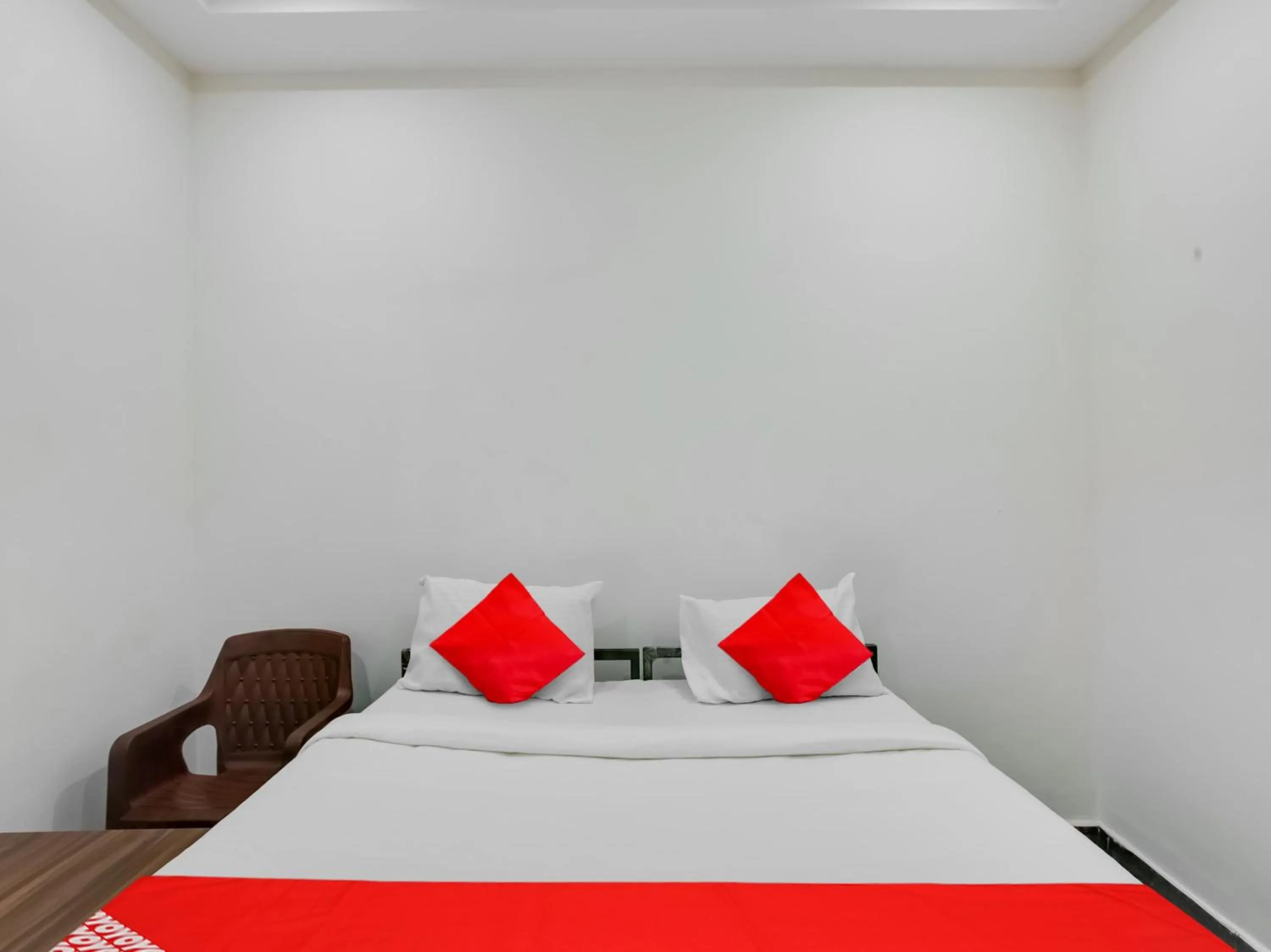 Bedroom in Hotel O Manjushree Boarding & Lodging nearby Dr.BR Ambedkar Stadium Basveshwar nagar