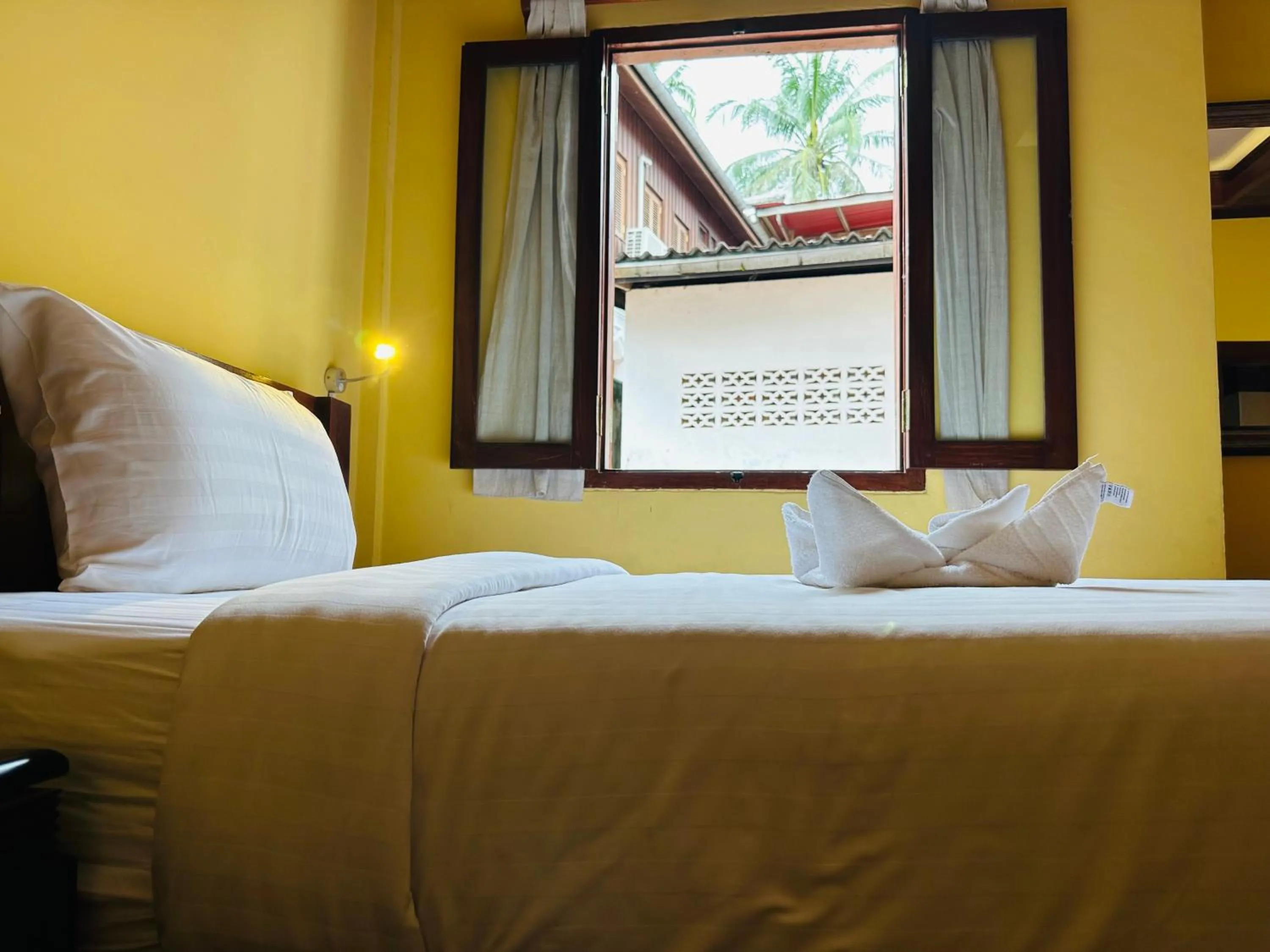 Bed in Villa Phonethip Mekong Riverside