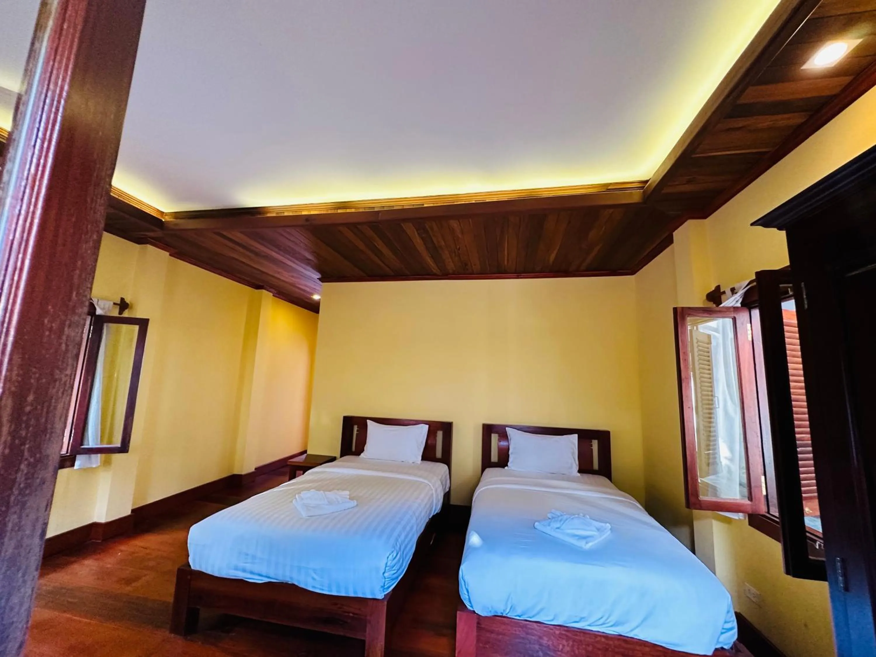 Bed in Villa Phonethip Mekong Riverside