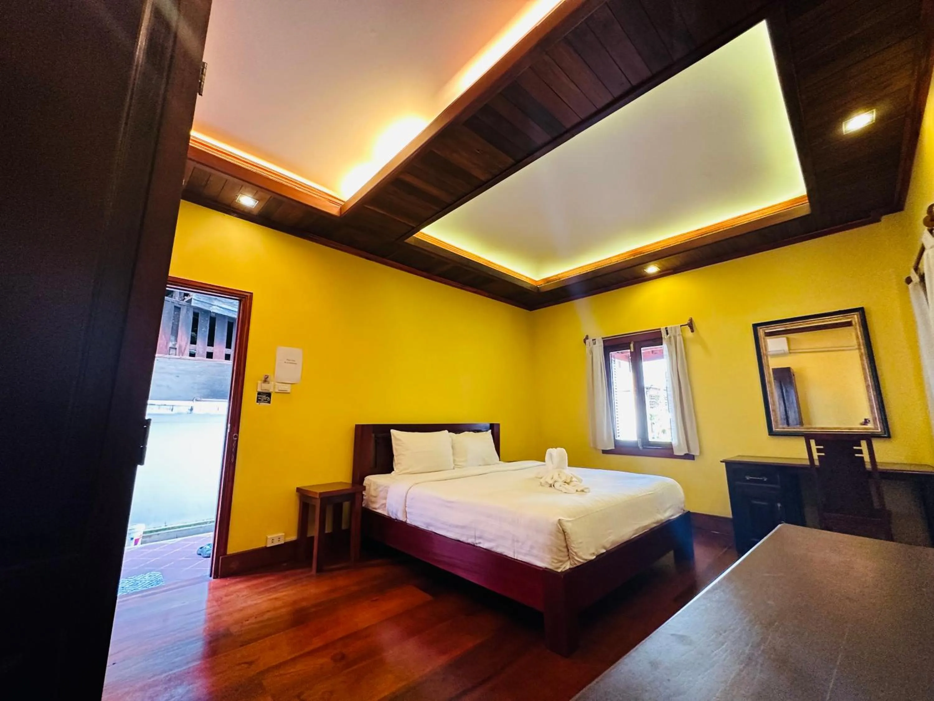 Bed in Villa Phonethip Mekong Riverside