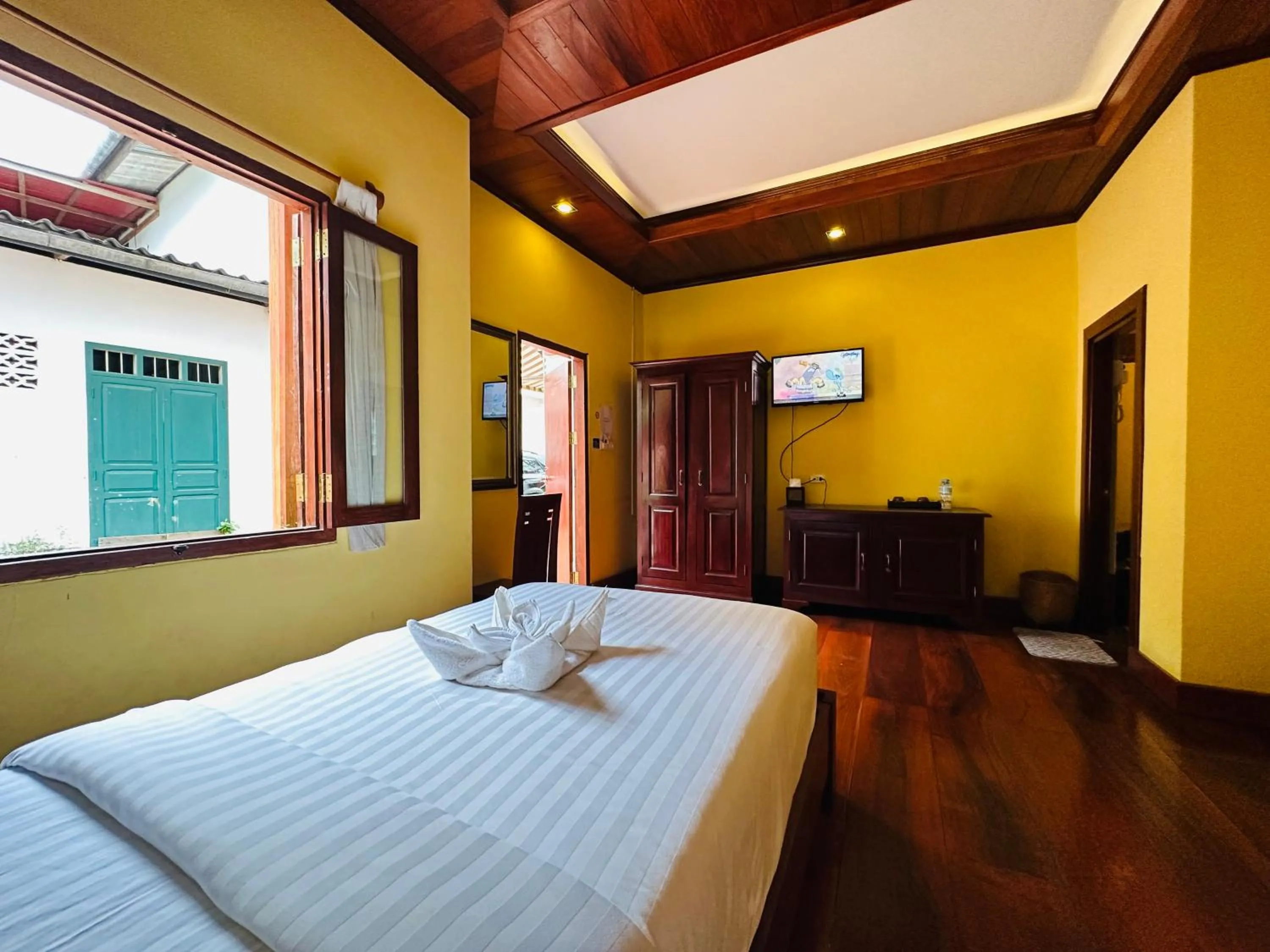 Bed in Villa Phonethip Mekong Riverside